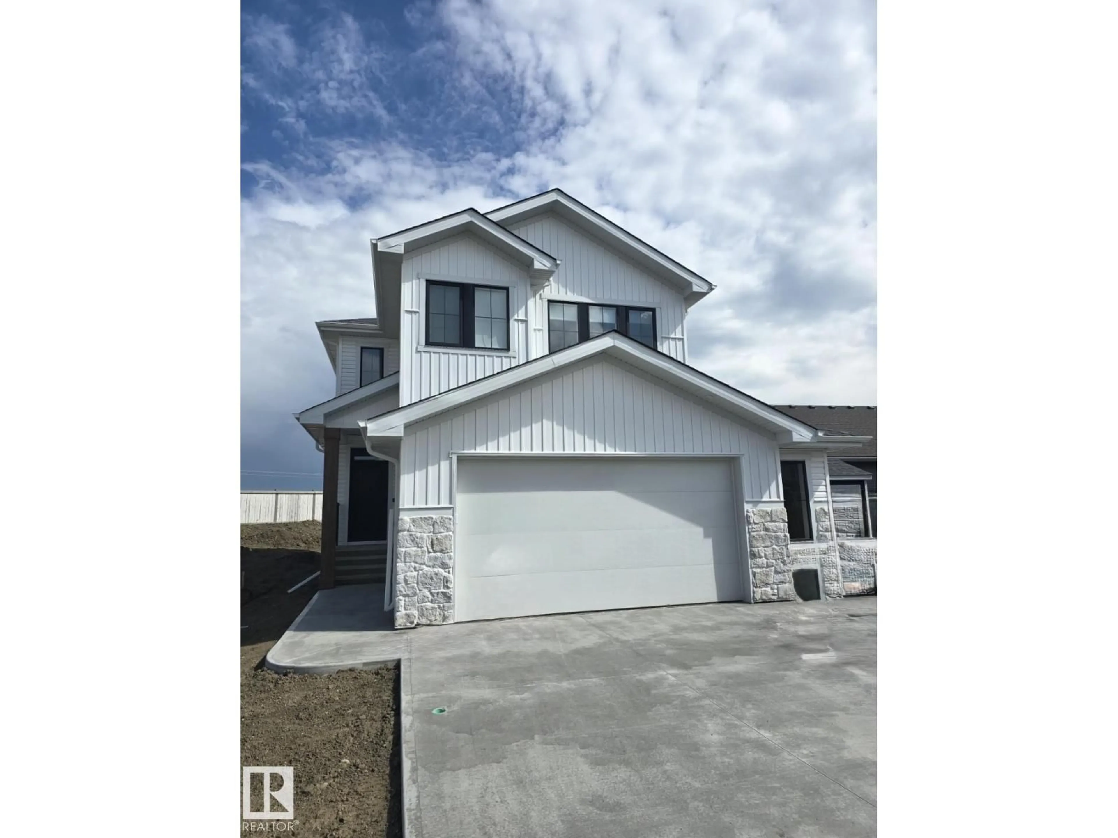 Home with vinyl exterior material, street for 8705 96A AVE, Morinville Alberta T8R2N9