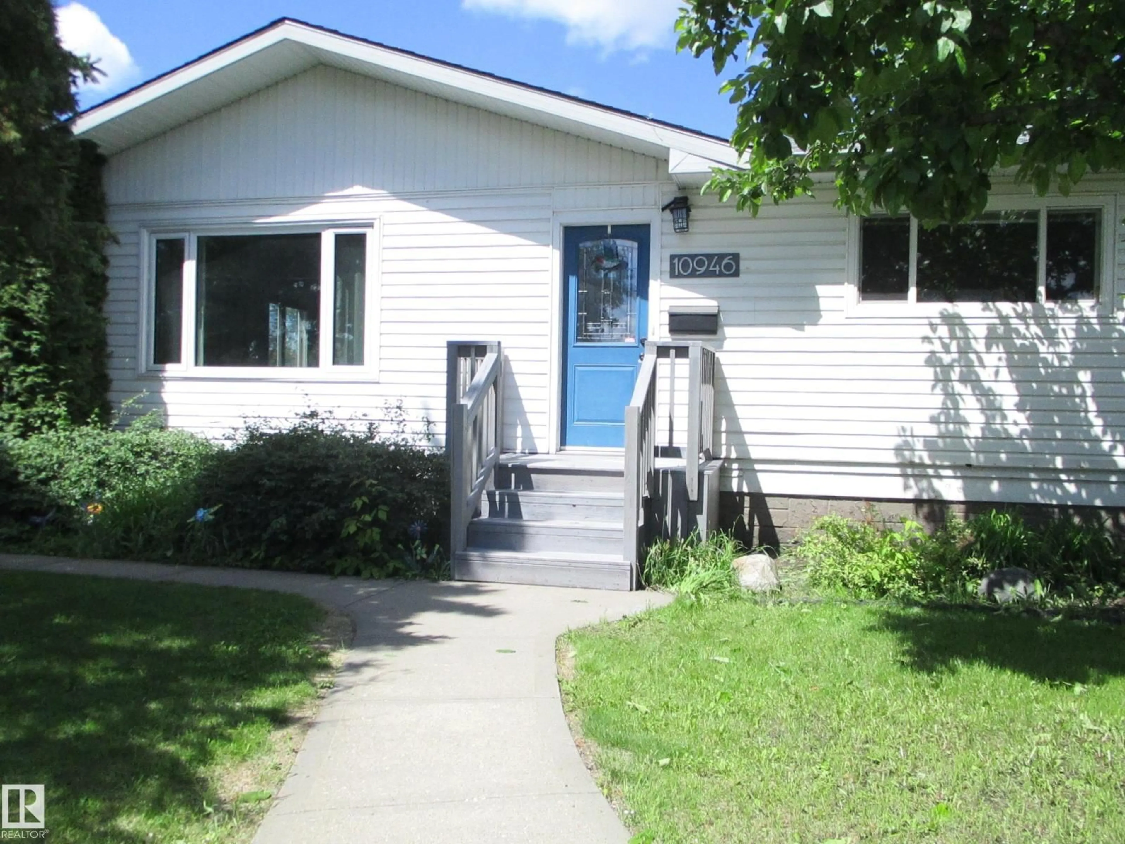 Home with vinyl exterior material, street for NW - 10946 165 ST, Edmonton Alberta T5P3T7