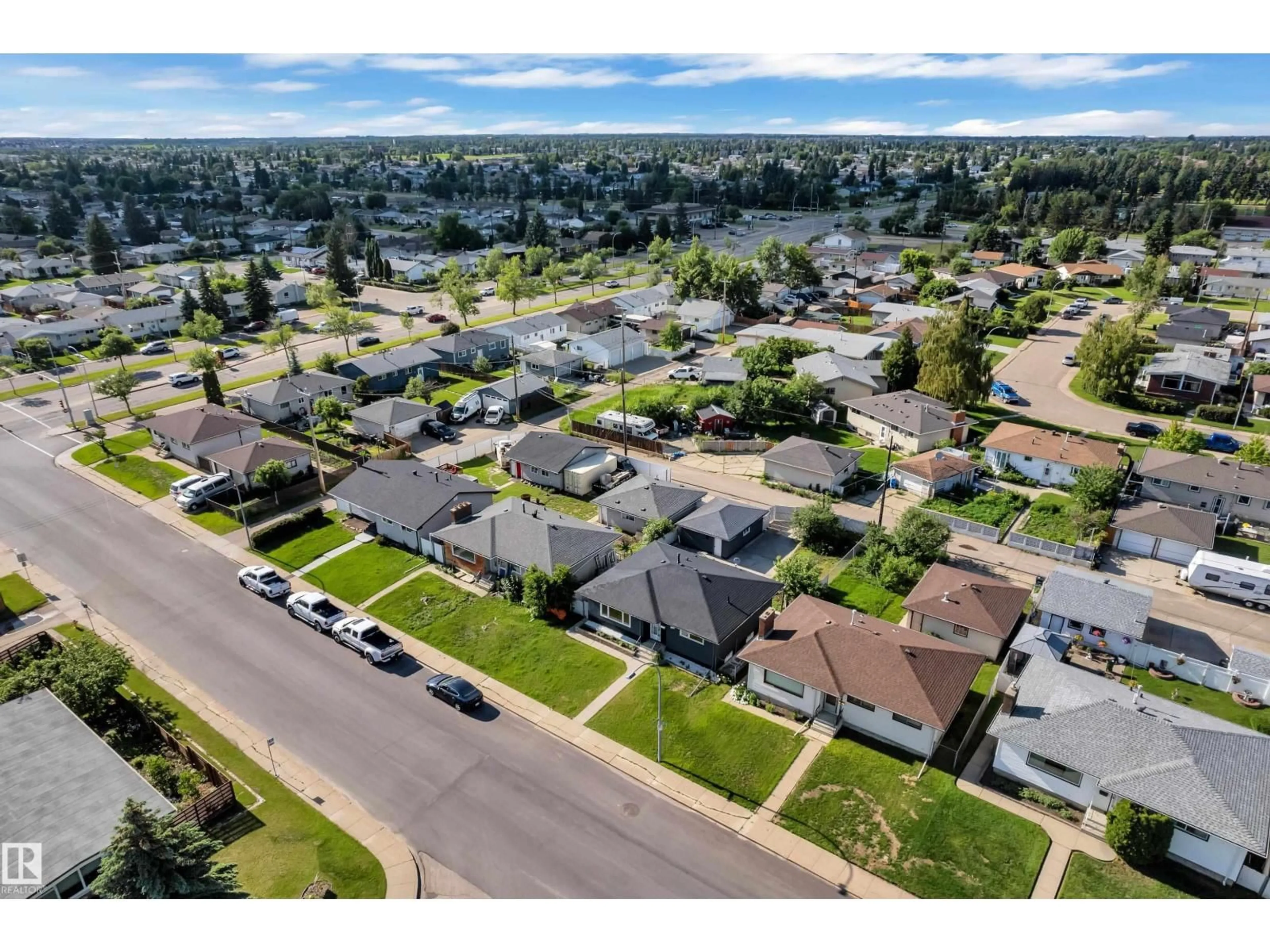 A pic from outside/outdoor area/front of a property/back of a property/a pic from drone, street for 8104 135 AV, Edmonton Alberta T5C2H4