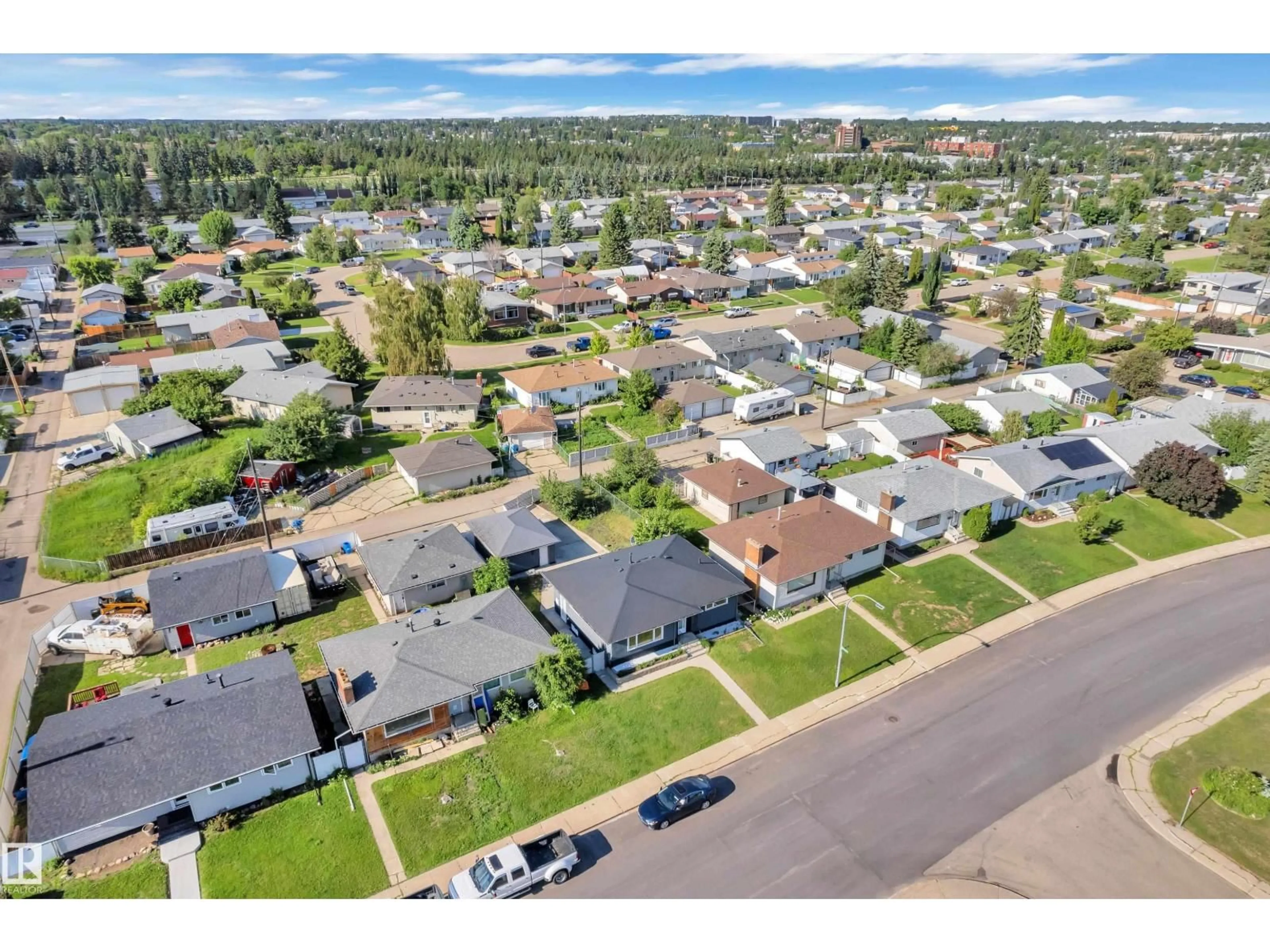 A pic from outside/outdoor area/front of a property/back of a property/a pic from drone, street for 8104 135 AV, Edmonton Alberta T5C2H4