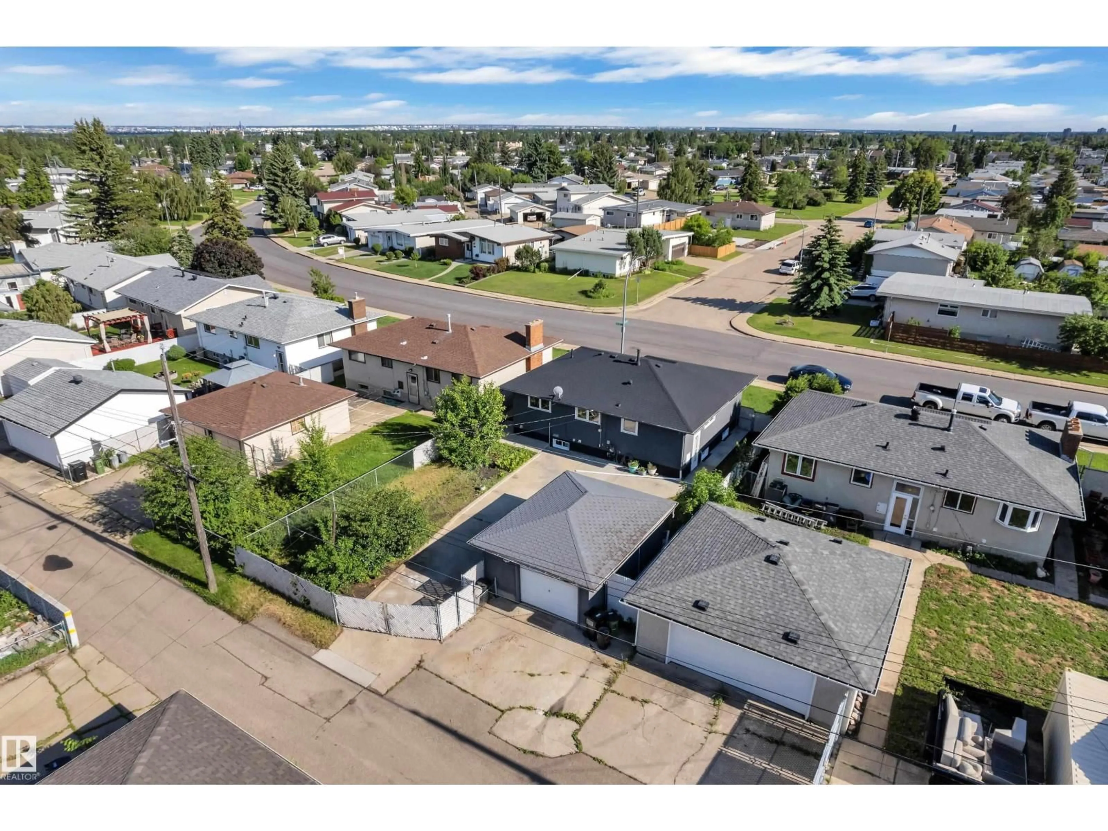 A pic from outside/outdoor area/front of a property/back of a property/a pic from drone, street for 8104 135 AV, Edmonton Alberta T5C2H4