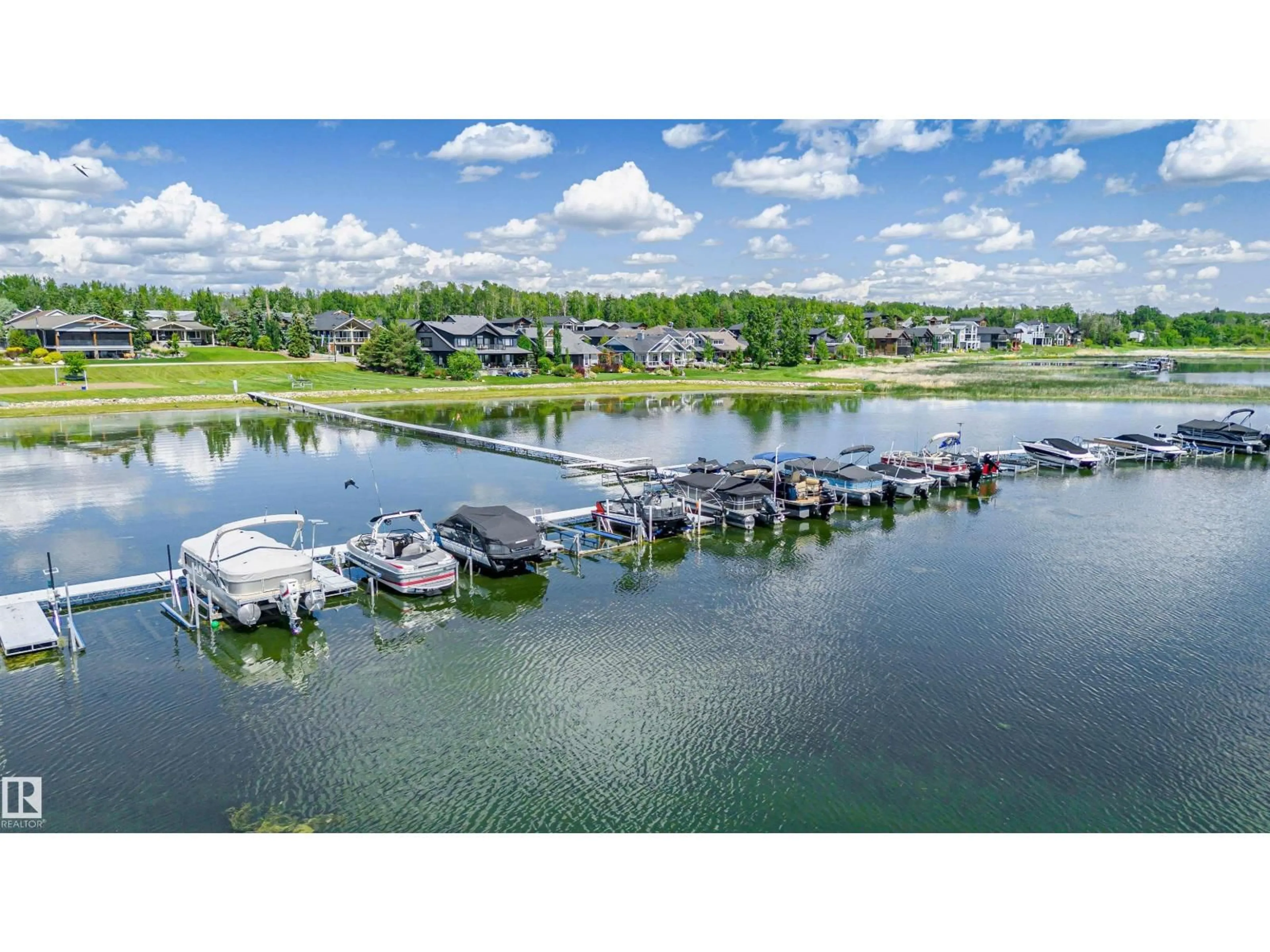 A pic from outside/outdoor area/front of a property/back of a property/a pic from drone, water/lake/river/ocean view for 504 STE. ANNE TR, Rural Lac Ste. Anne County Alberta T0E1A1
