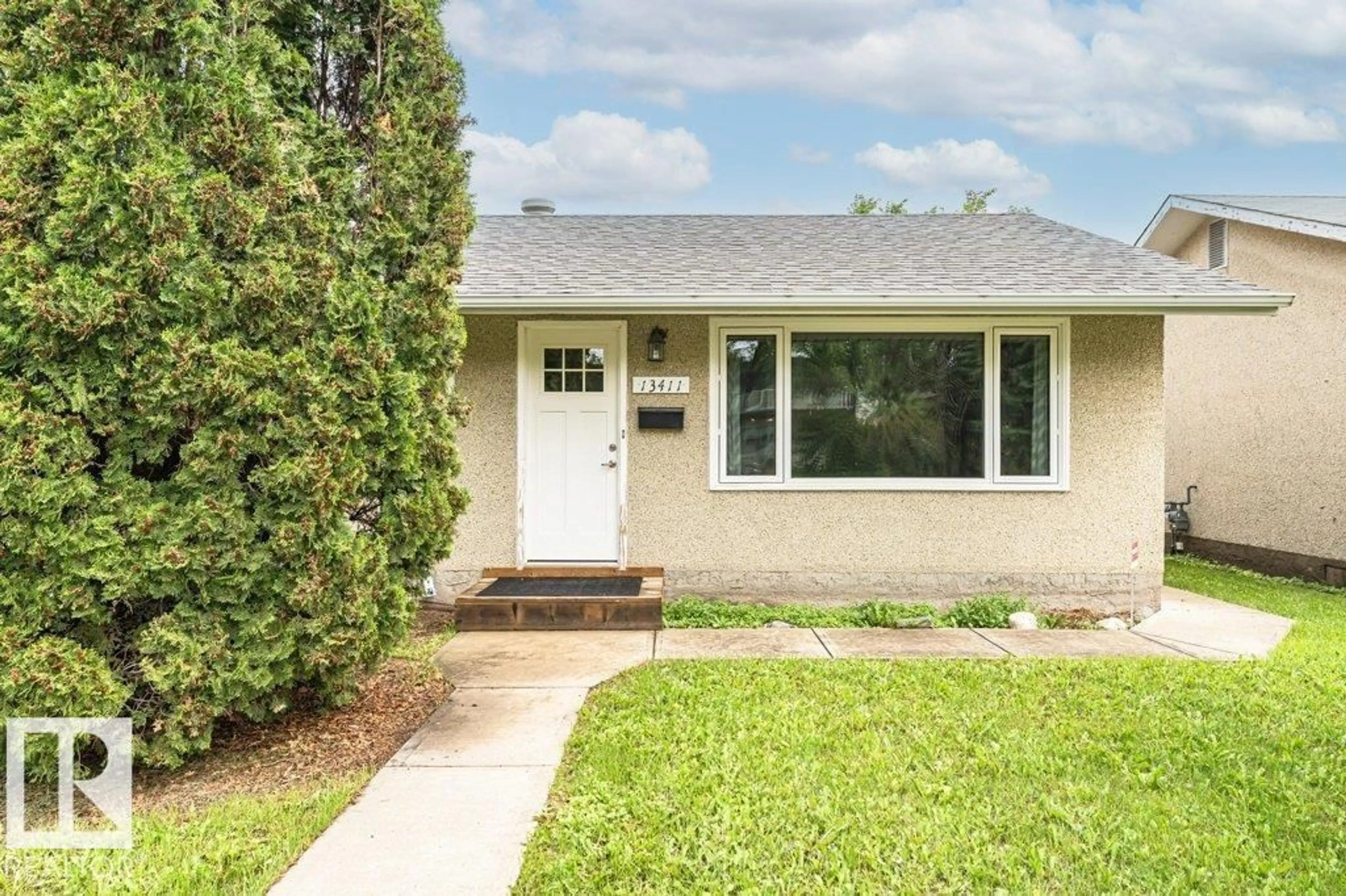 Home with vinyl exterior material, street for 13411 140 ST, Edmonton Alberta T5L2E4