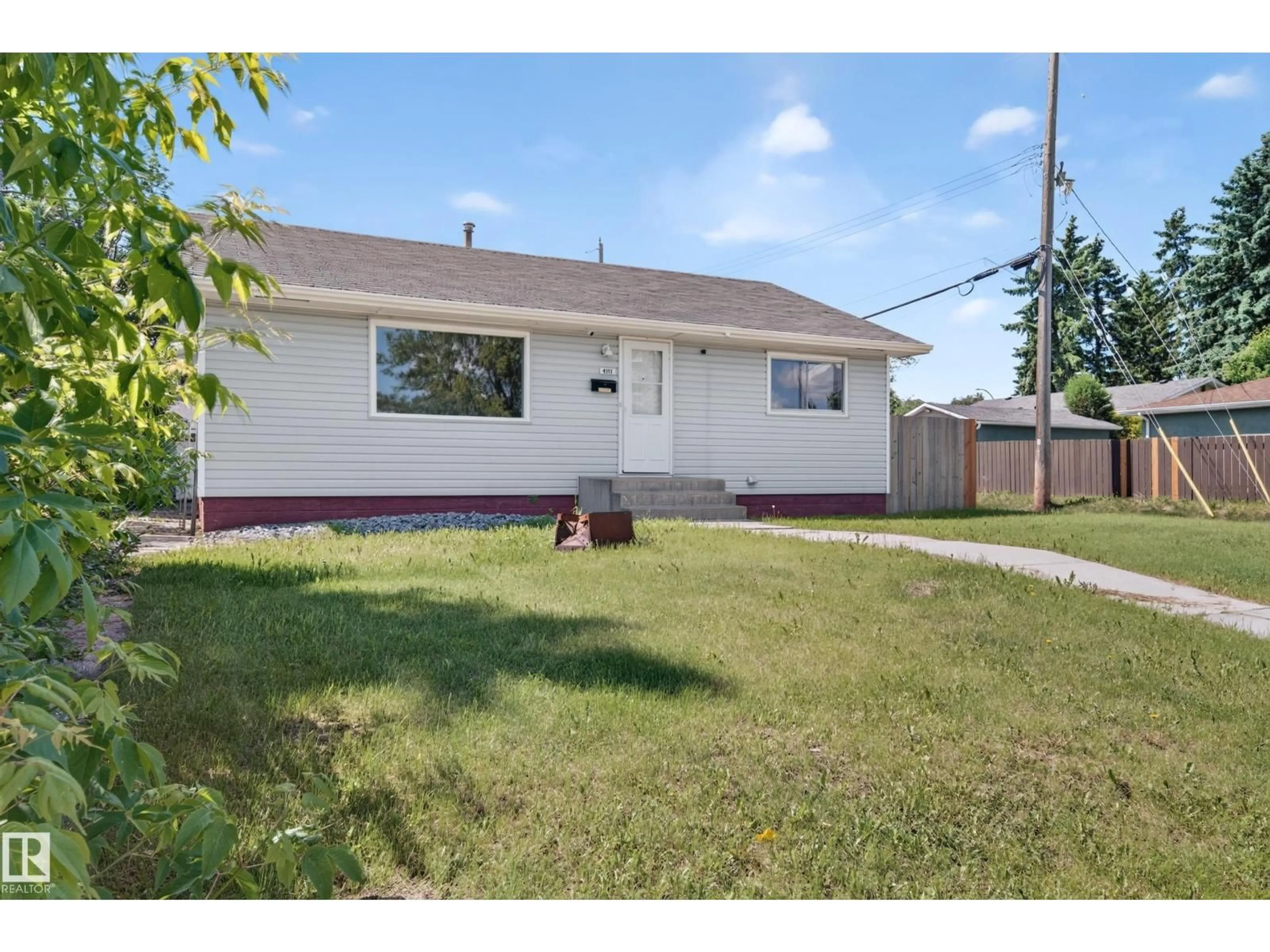 Home with vinyl exterior material, street for 4311 105A AV, Edmonton Alberta T6A1B2