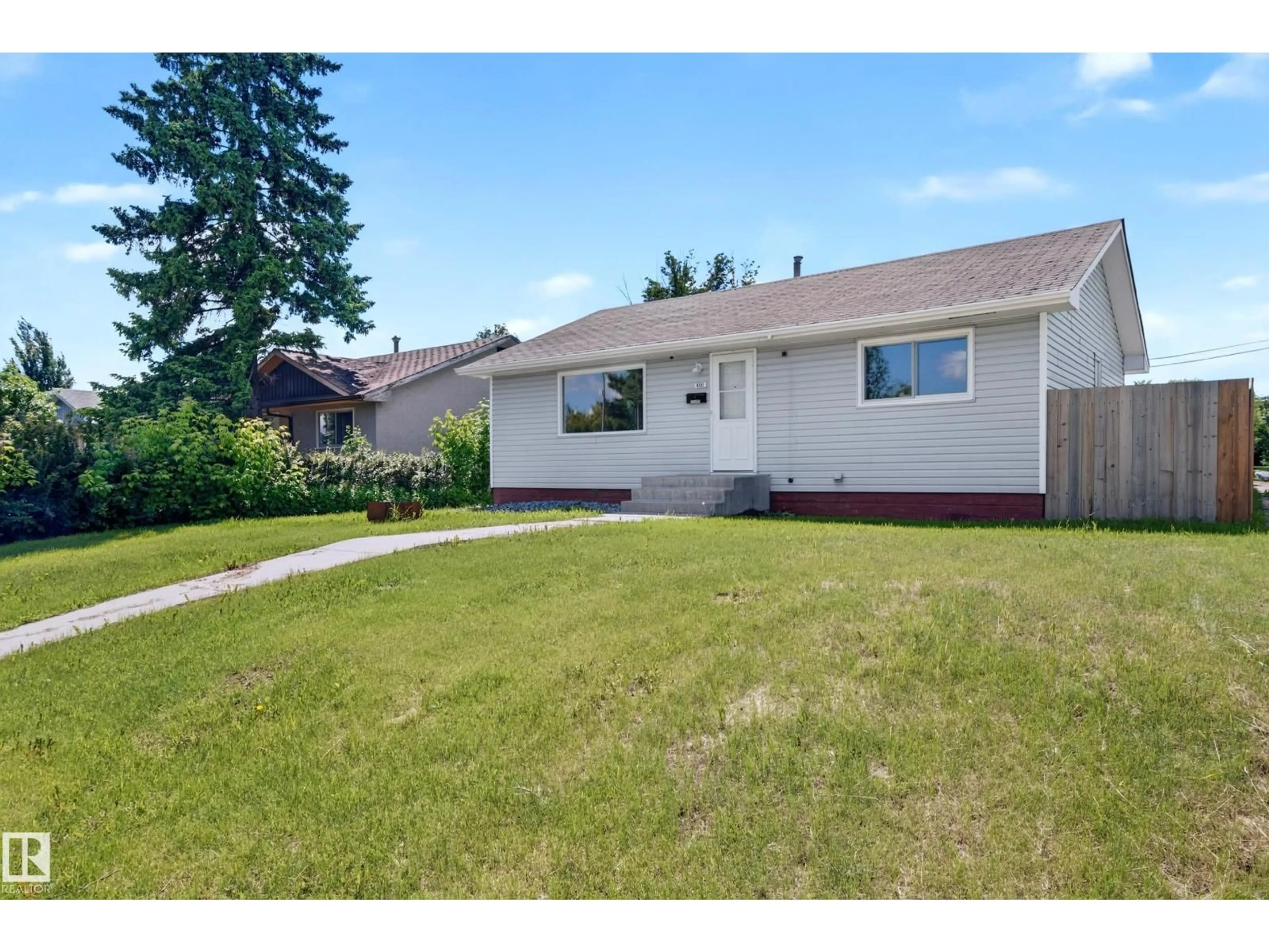 Home with vinyl exterior material, street for 4311 105A AV, Edmonton Alberta T6A1B2