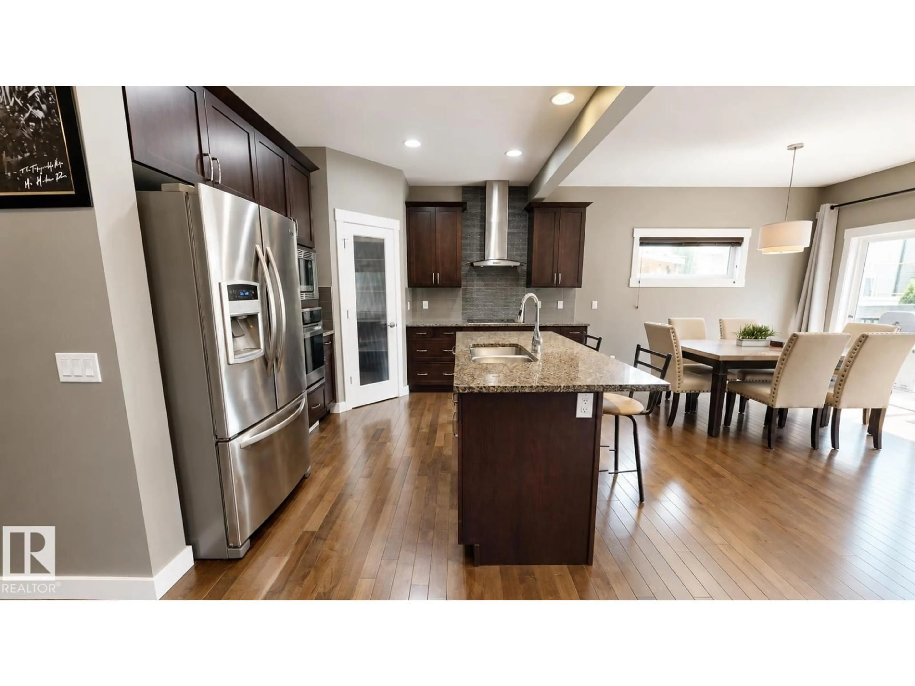 Open concept kitchen, wood/laminate floor for 110 MEADOWLAND WY, Spruce Grove Alberta T7X0S4