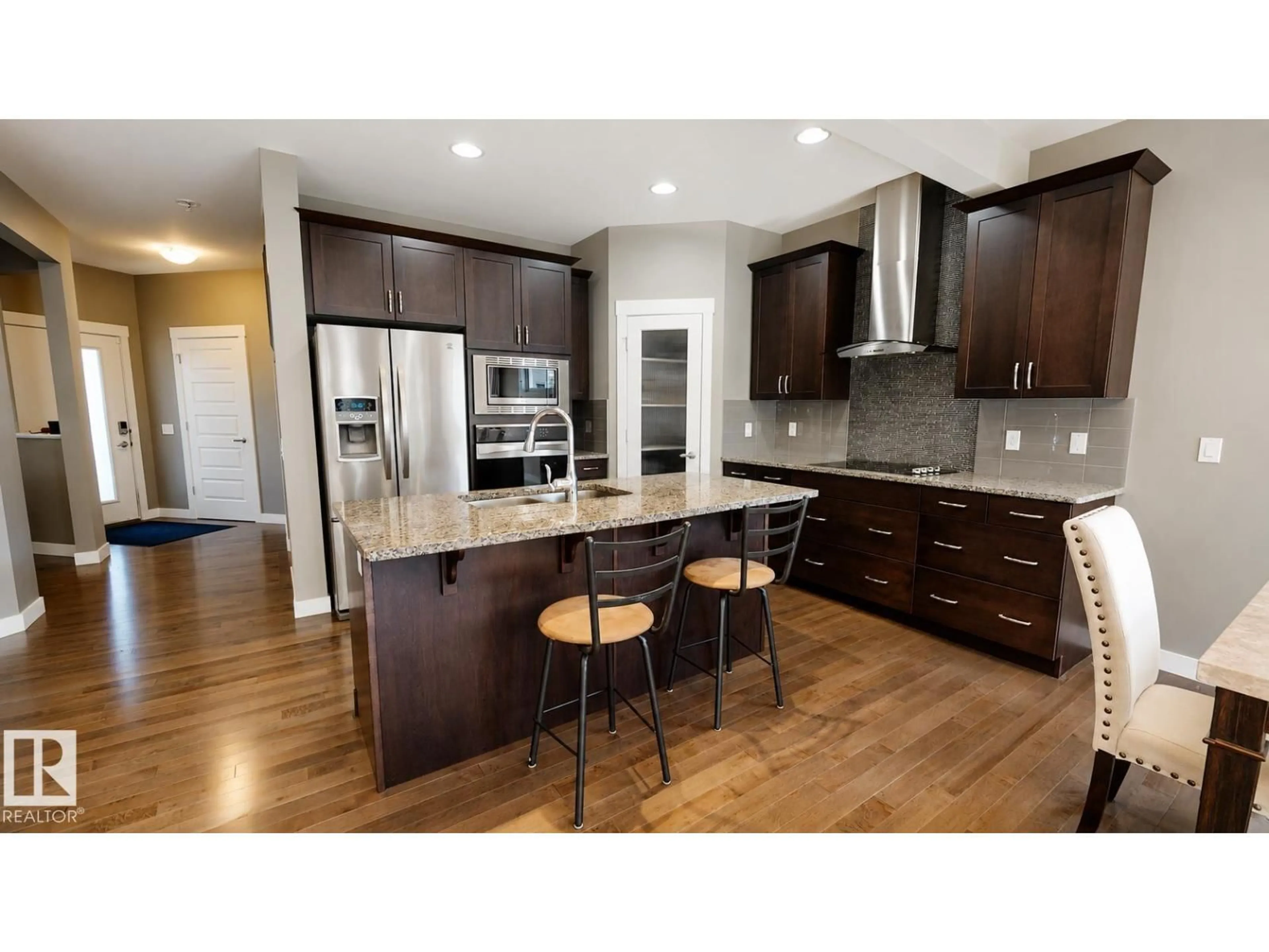 Open concept kitchen, wood/laminate floor for 110 MEADOWLAND WY, Spruce Grove Alberta T7X0S4