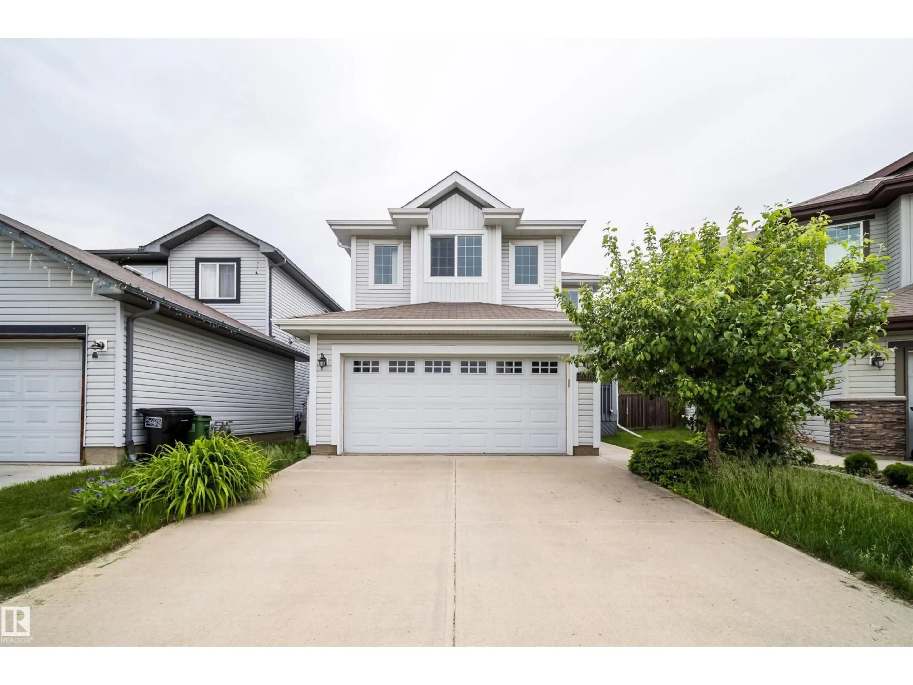 Home with vinyl exterior material, street for SW - 11312 13 AVE, Edmonton Alberta T6W0G9