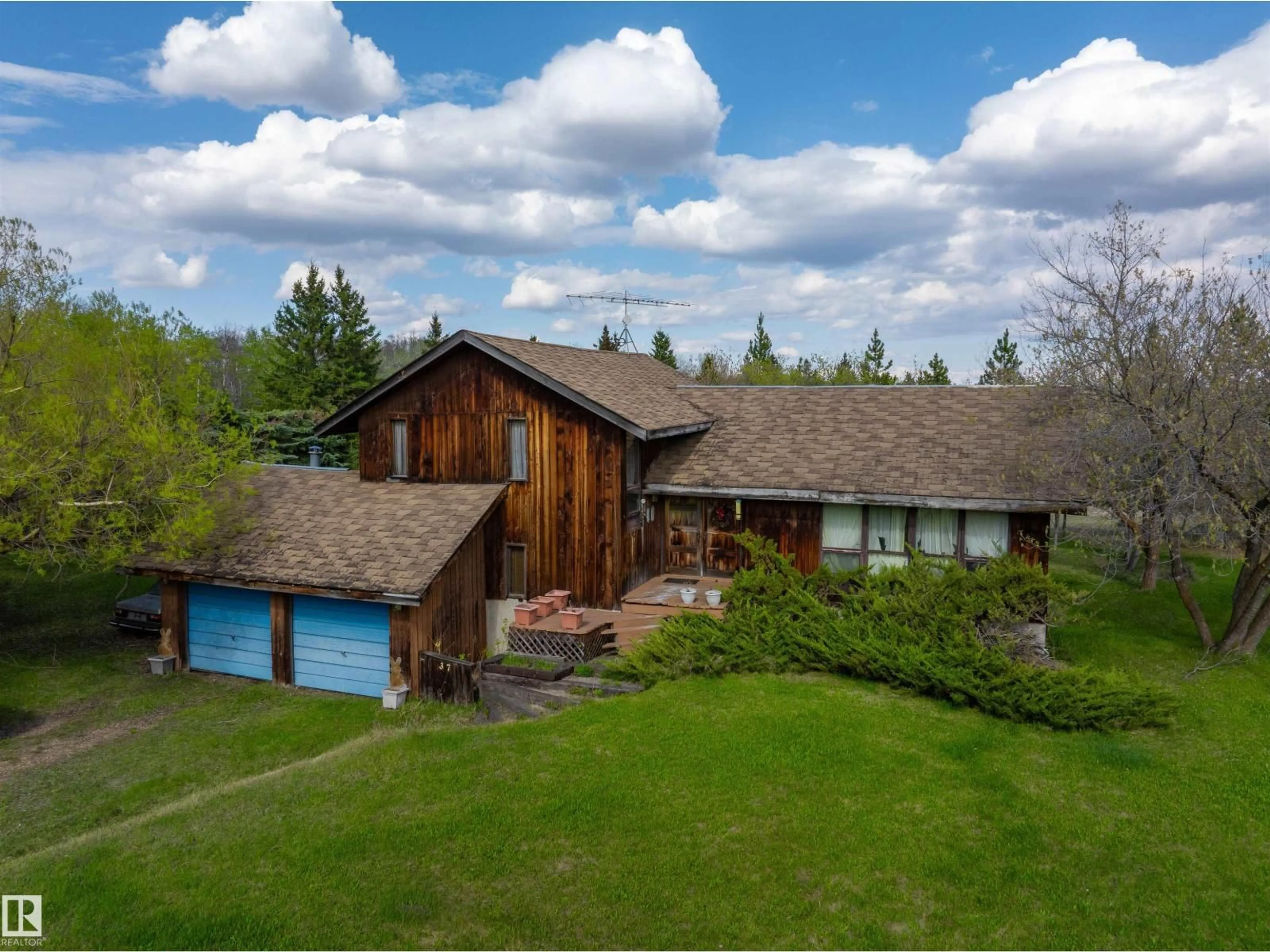 A pic from outside/outdoor area/front of a property/back of a property/a pic from drone, unknown for #37 - 21032 TWP ROAD 540, Rural Strathcona County Alberta T8G2A6