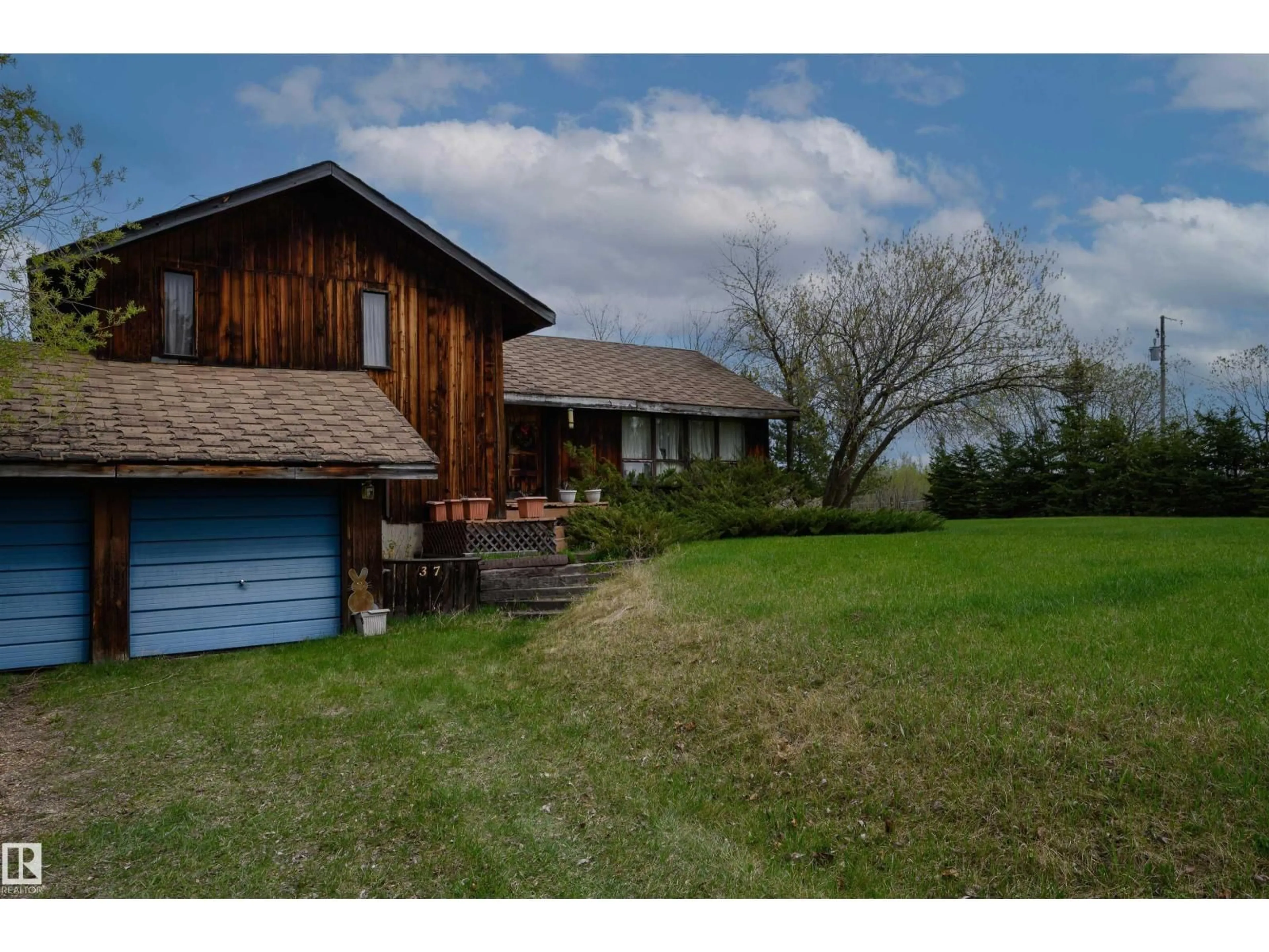 A pic from outside/outdoor area/front of a property/back of a property/a pic from drone, unknown for #37 - 21032 TWP ROAD 540, Rural Strathcona County Alberta T8G2A6