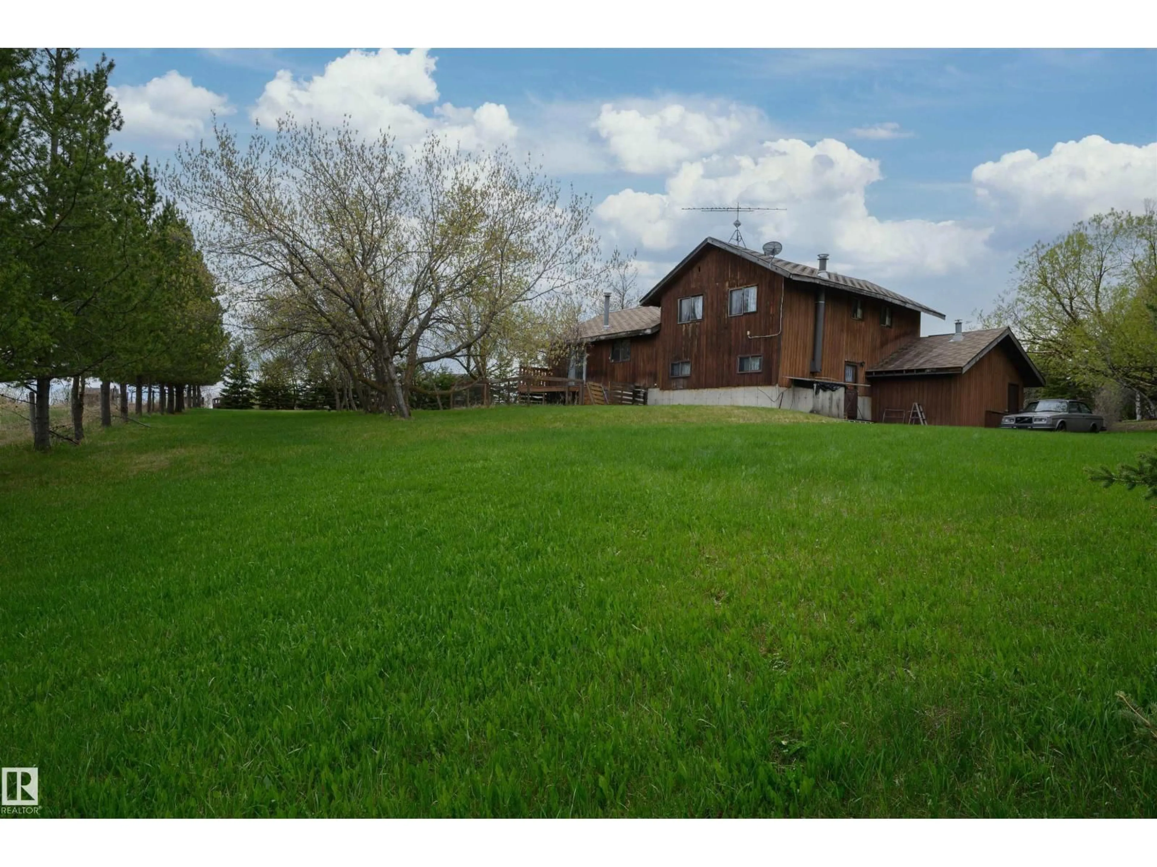 A pic from outside/outdoor area/front of a property/back of a property/a pic from drone, unknown for #37 - 21032 TWP ROAD 540, Rural Strathcona County Alberta T8G2A6