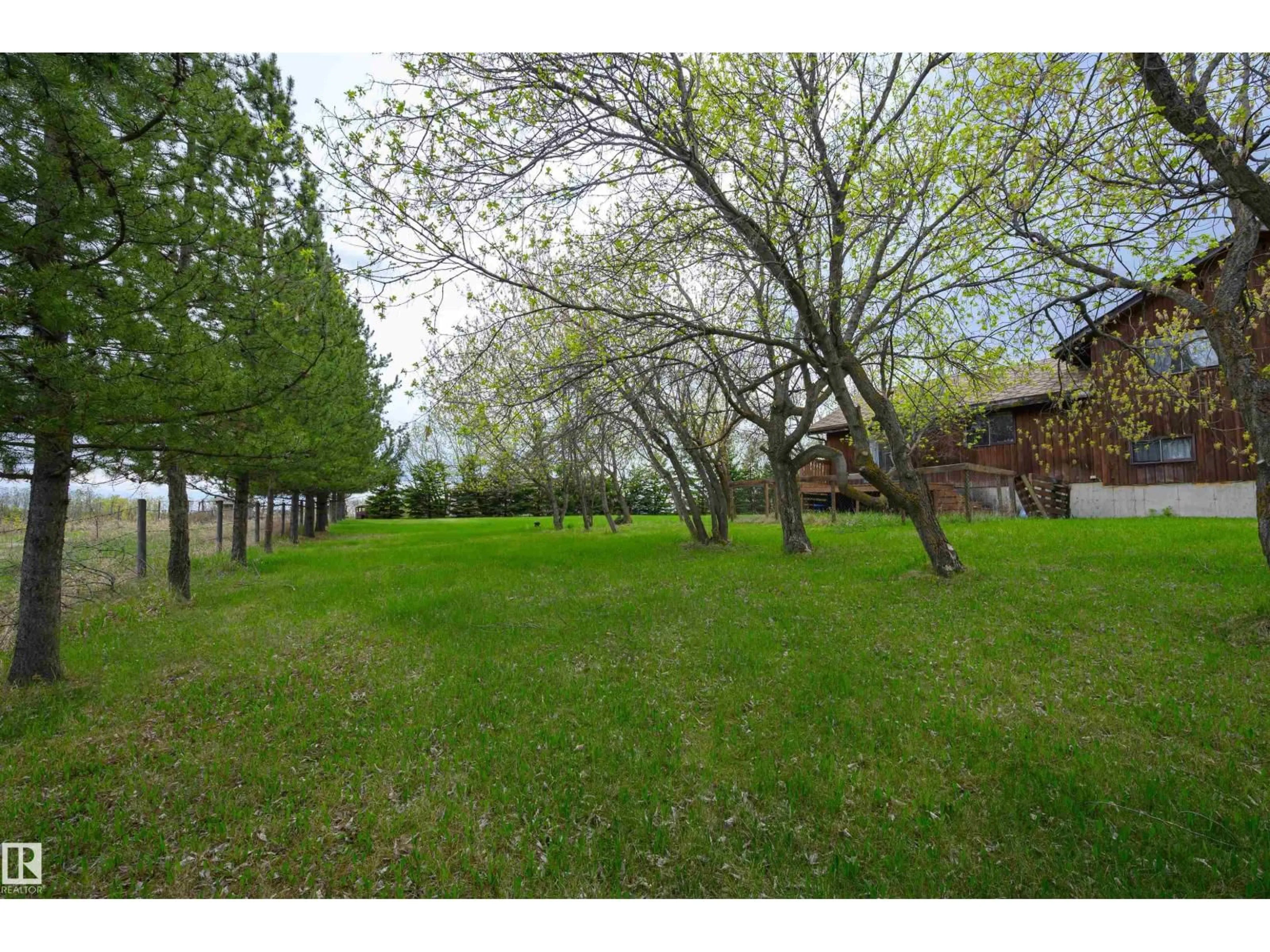 A pic from outside/outdoor area/front of a property/back of a property/a pic from drone, forest/trees view for #37 - 21032 TWP ROAD 540, Rural Strathcona County Alberta T8G2A6