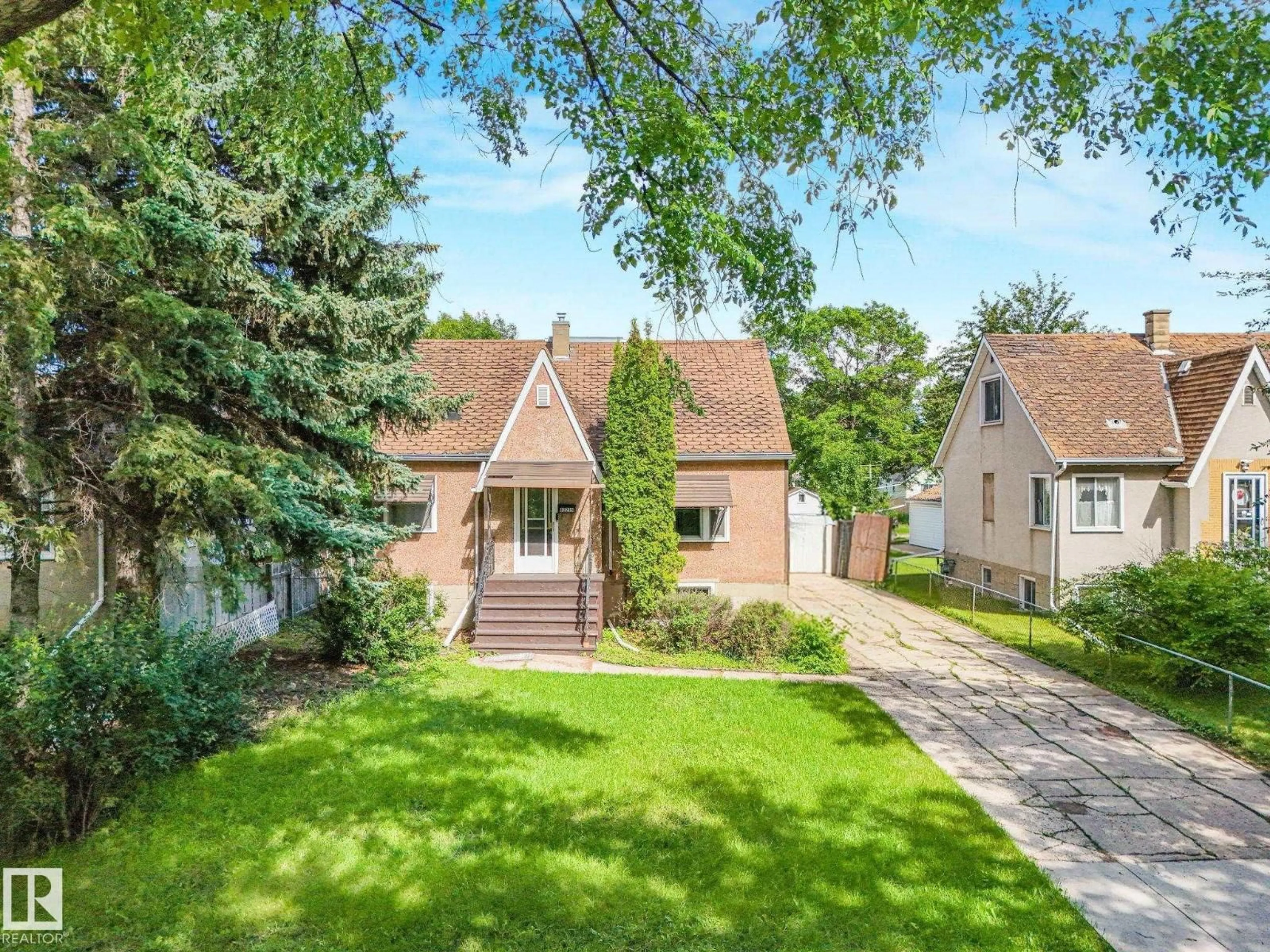 A pic from outside/outdoor area/front of a property/back of a property/a pic from drone, street for 12215 103 ST, Edmonton Alberta T5G2K2