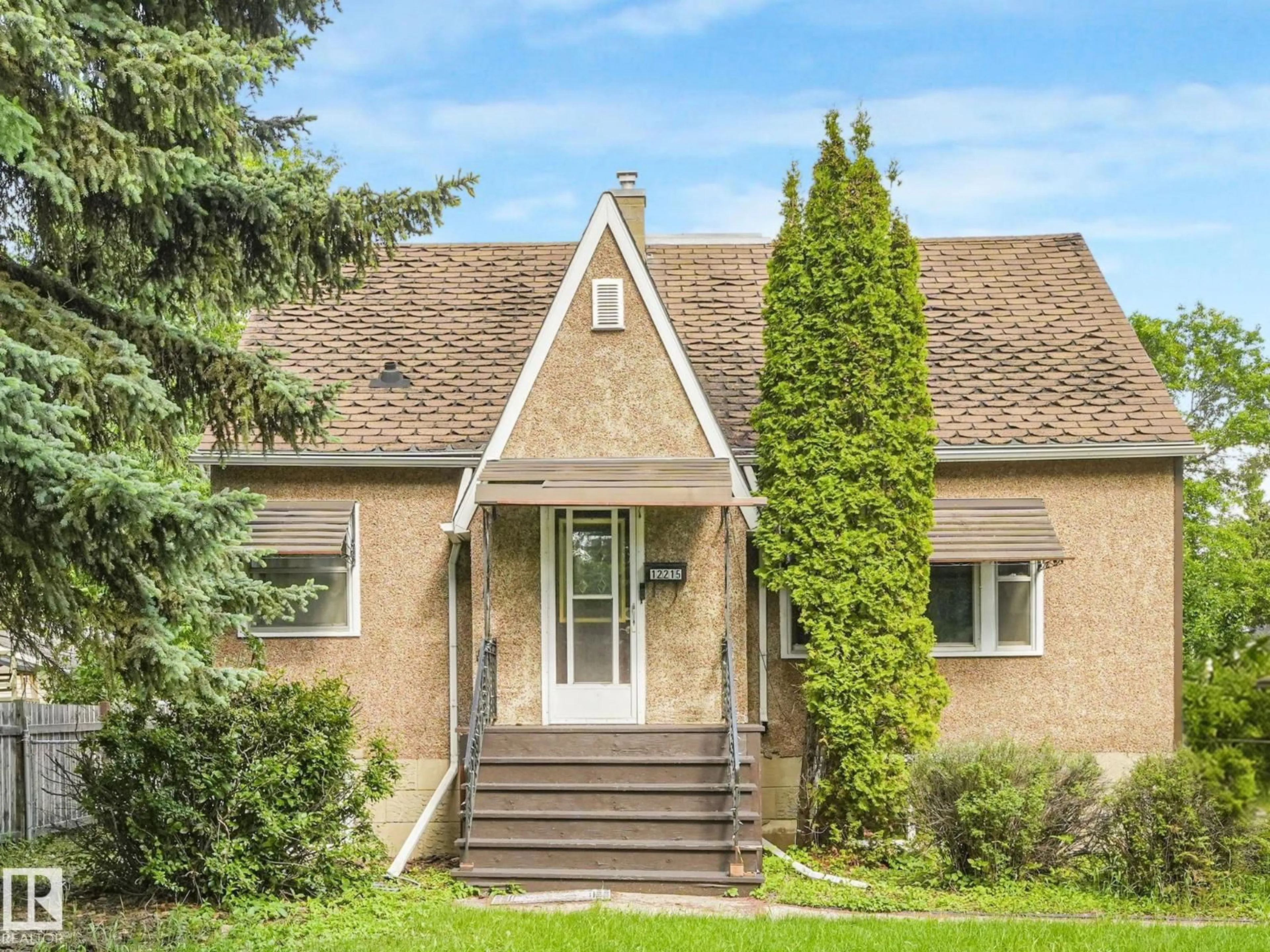 Home with brick exterior material, street for 12215 103 ST, Edmonton Alberta T5G2K2