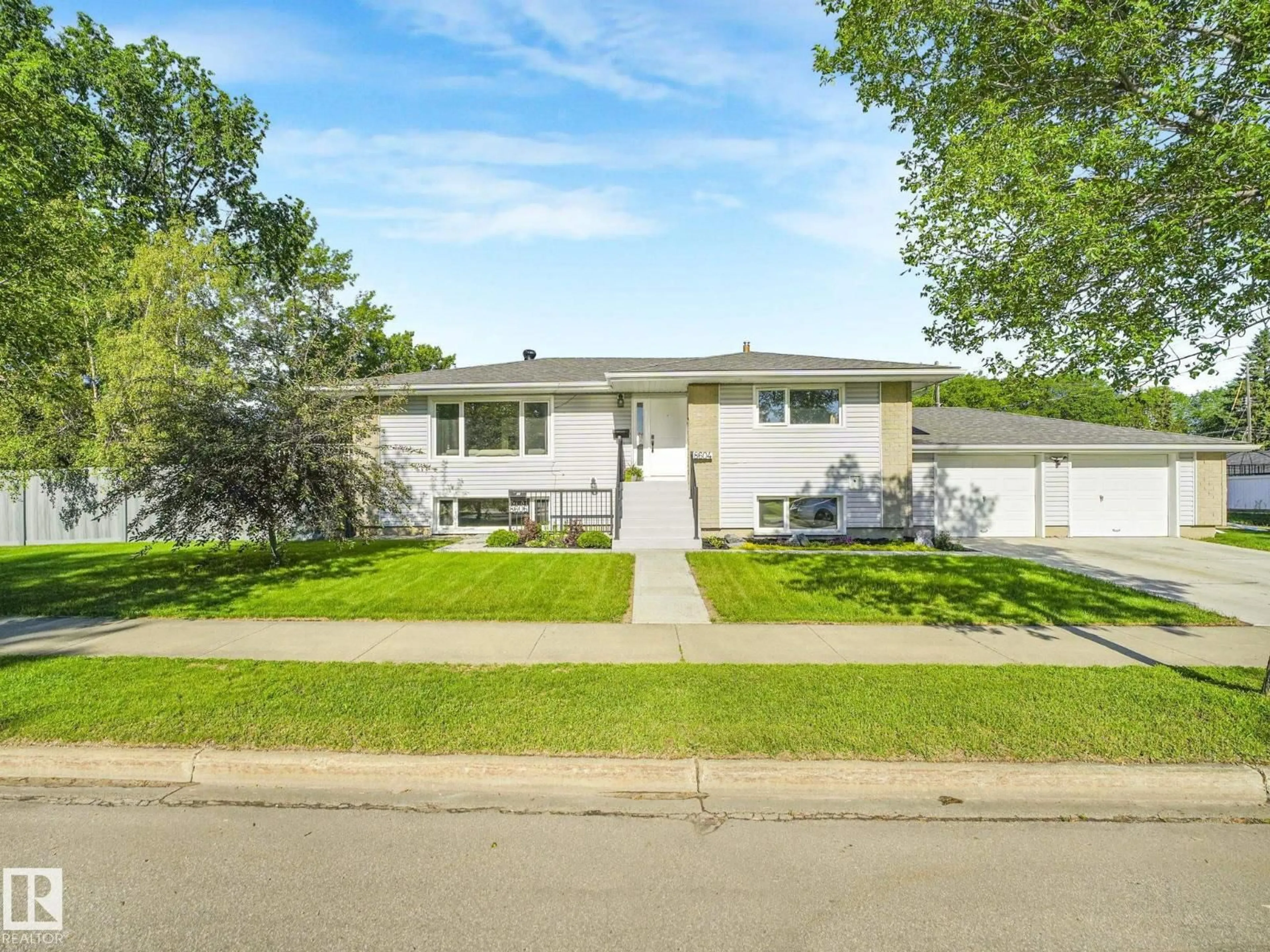 Home with vinyl exterior material, street for NW - 8604/8606 79 ST, Edmonton Alberta T6C2P5
