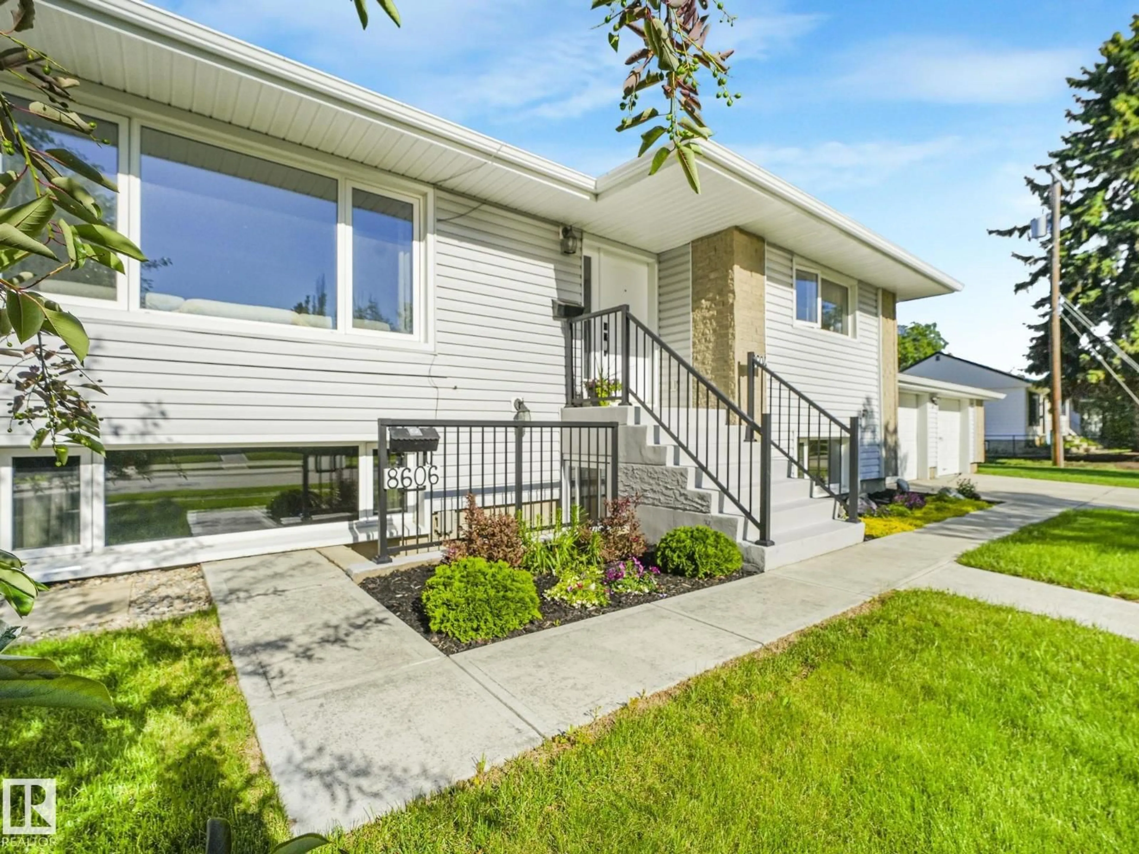 Home with vinyl exterior material, street for NW - 8604/8606 79 ST, Edmonton Alberta T6C2P5