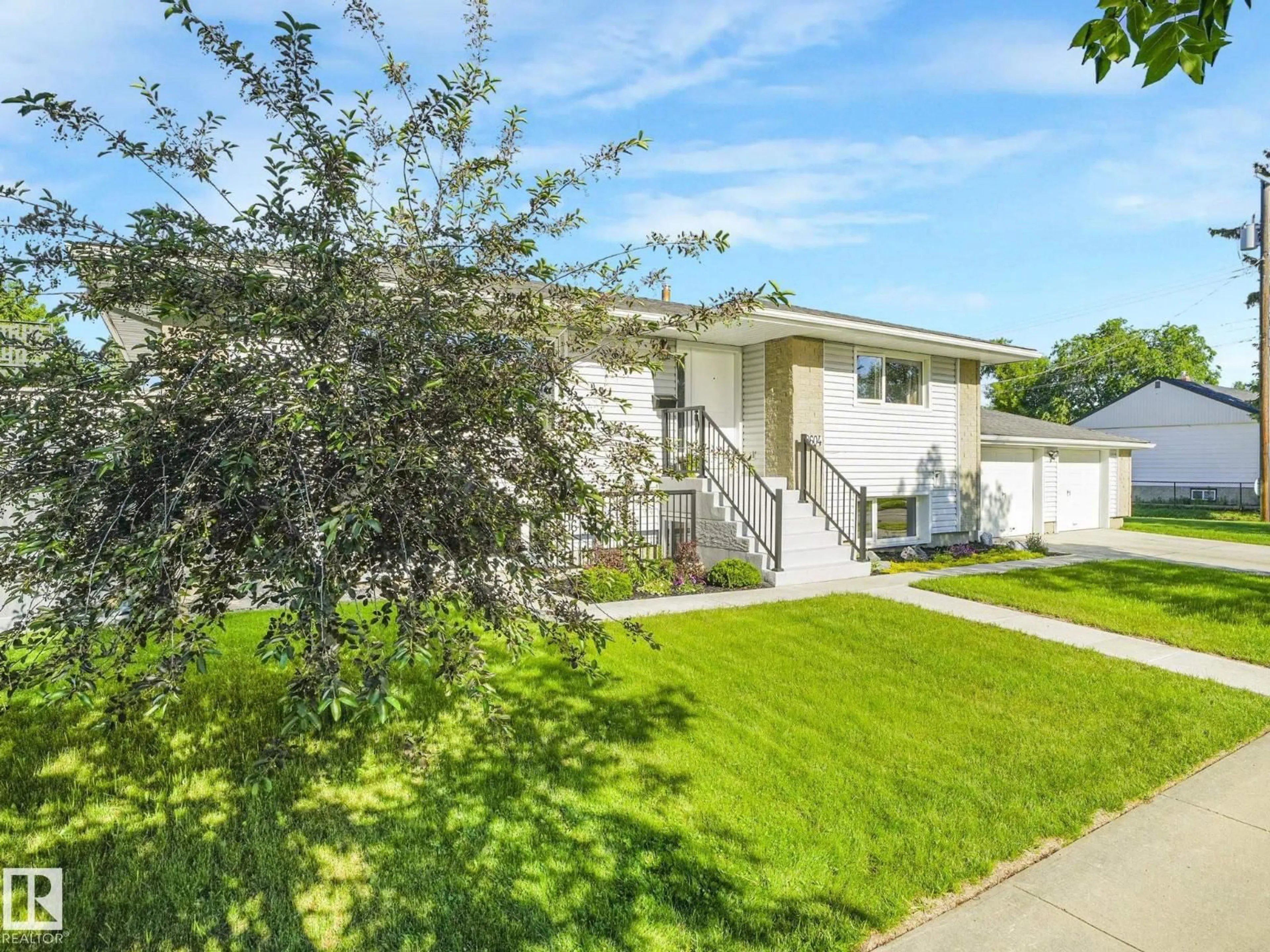 Home with vinyl exterior material, street for NW - 8604/8606 79 ST, Edmonton Alberta T6C2P5