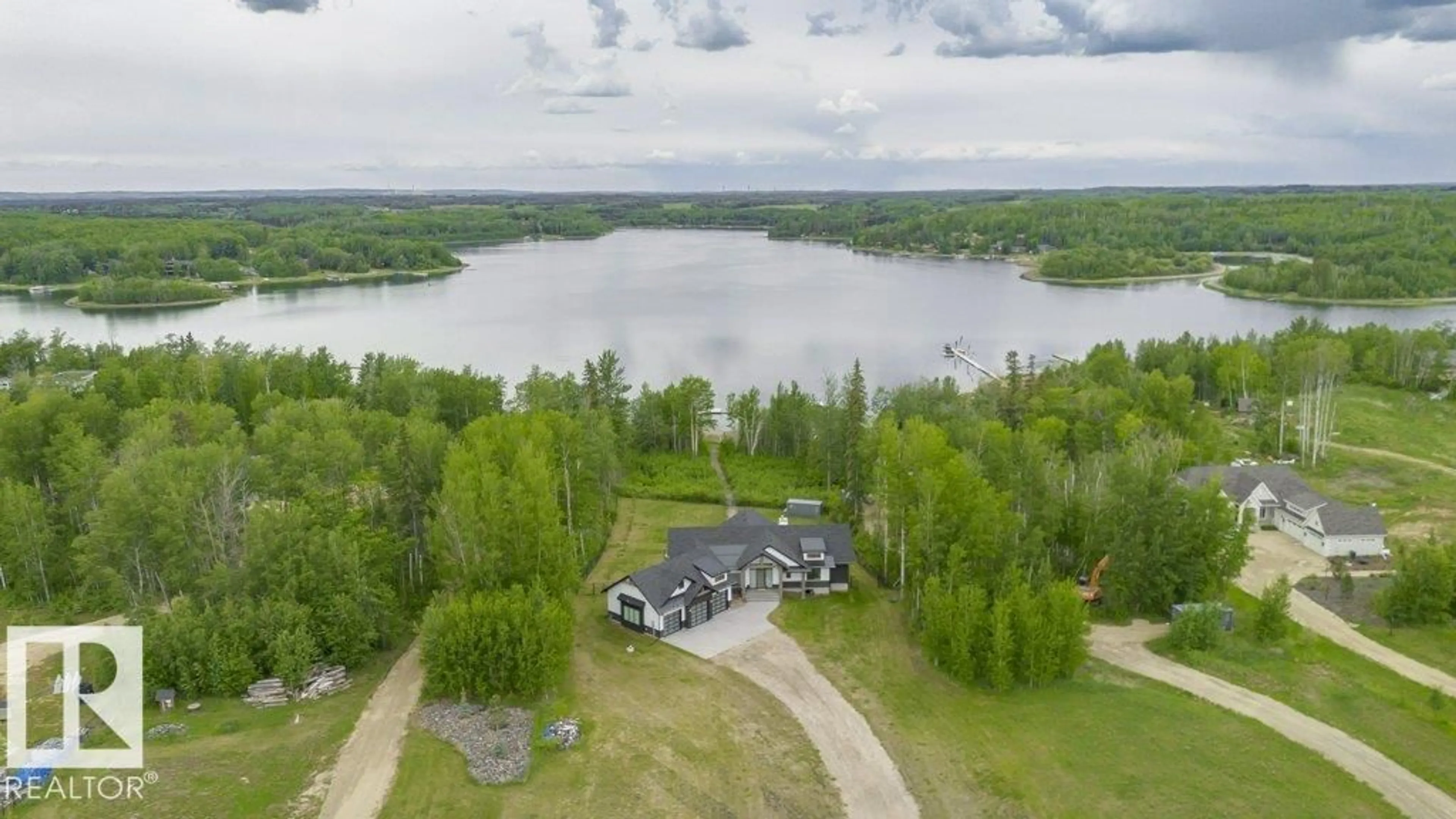 A pic from outside/outdoor area/front of a property/back of a property/a pic from drone, water/lake/river/ocean view for 42 - 2307 TWP ROAD 522, Rural Parkland County Alberta T7Y3L7