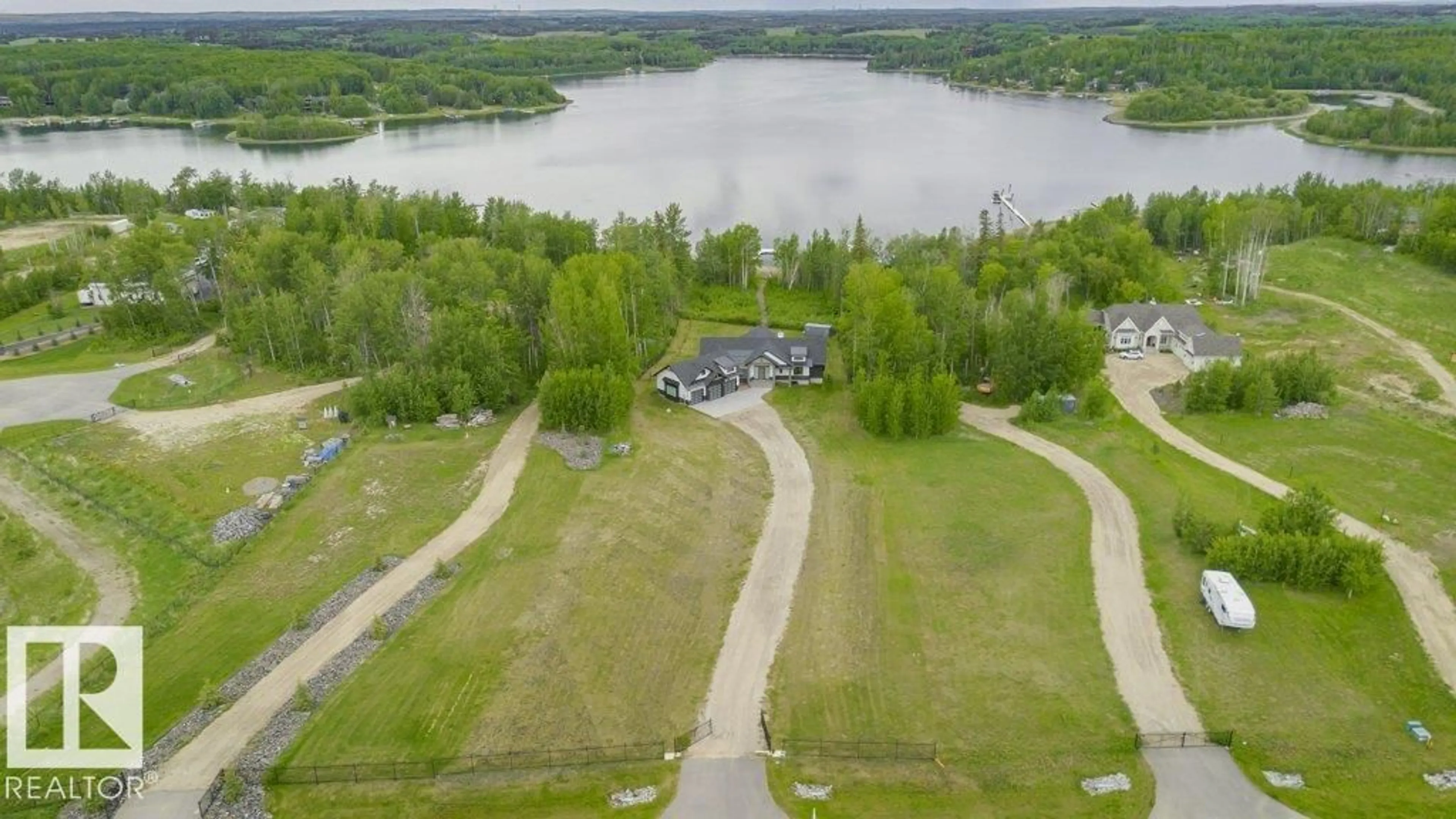 A pic from outside/outdoor area/front of a property/back of a property/a pic from drone, water/lake/river/ocean view for 42 - 2307 TWP ROAD 522, Rural Parkland County Alberta T7Y3L7