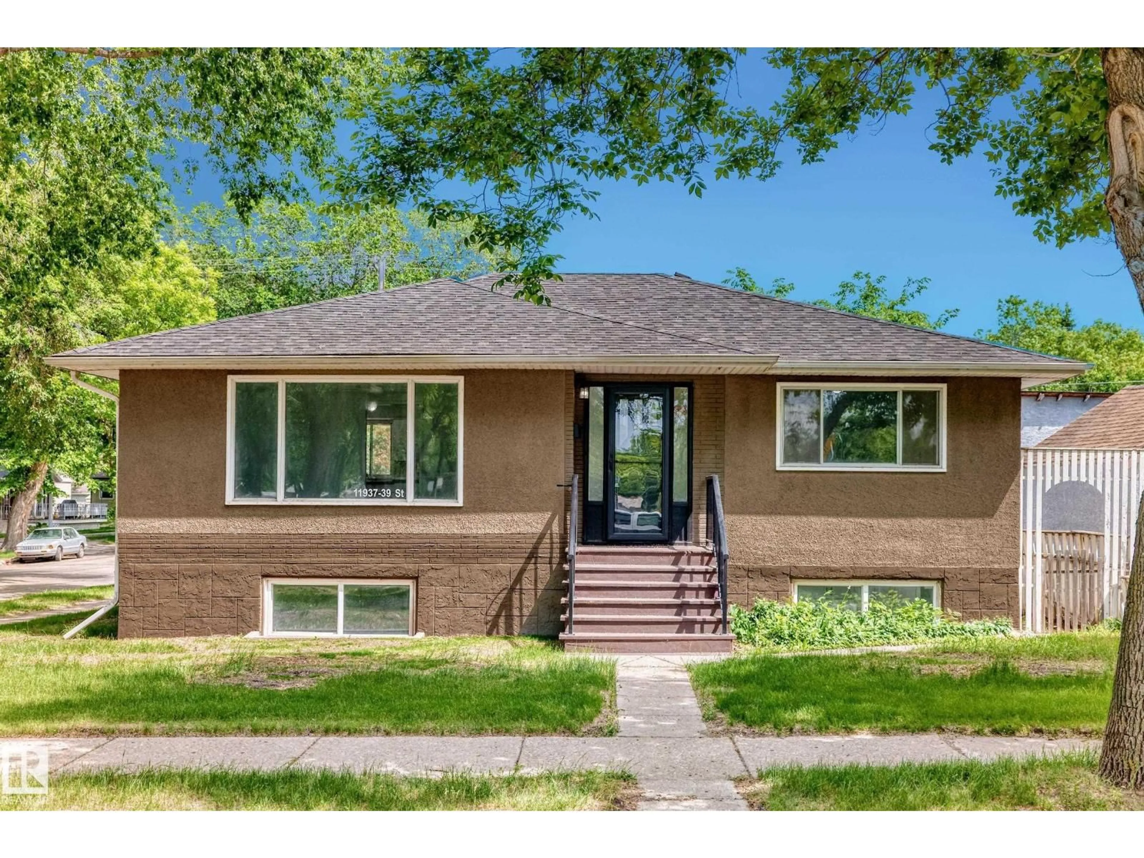 Home with brick exterior material, street for NW - 11937 39 ST, Edmonton Alberta T5W2J6