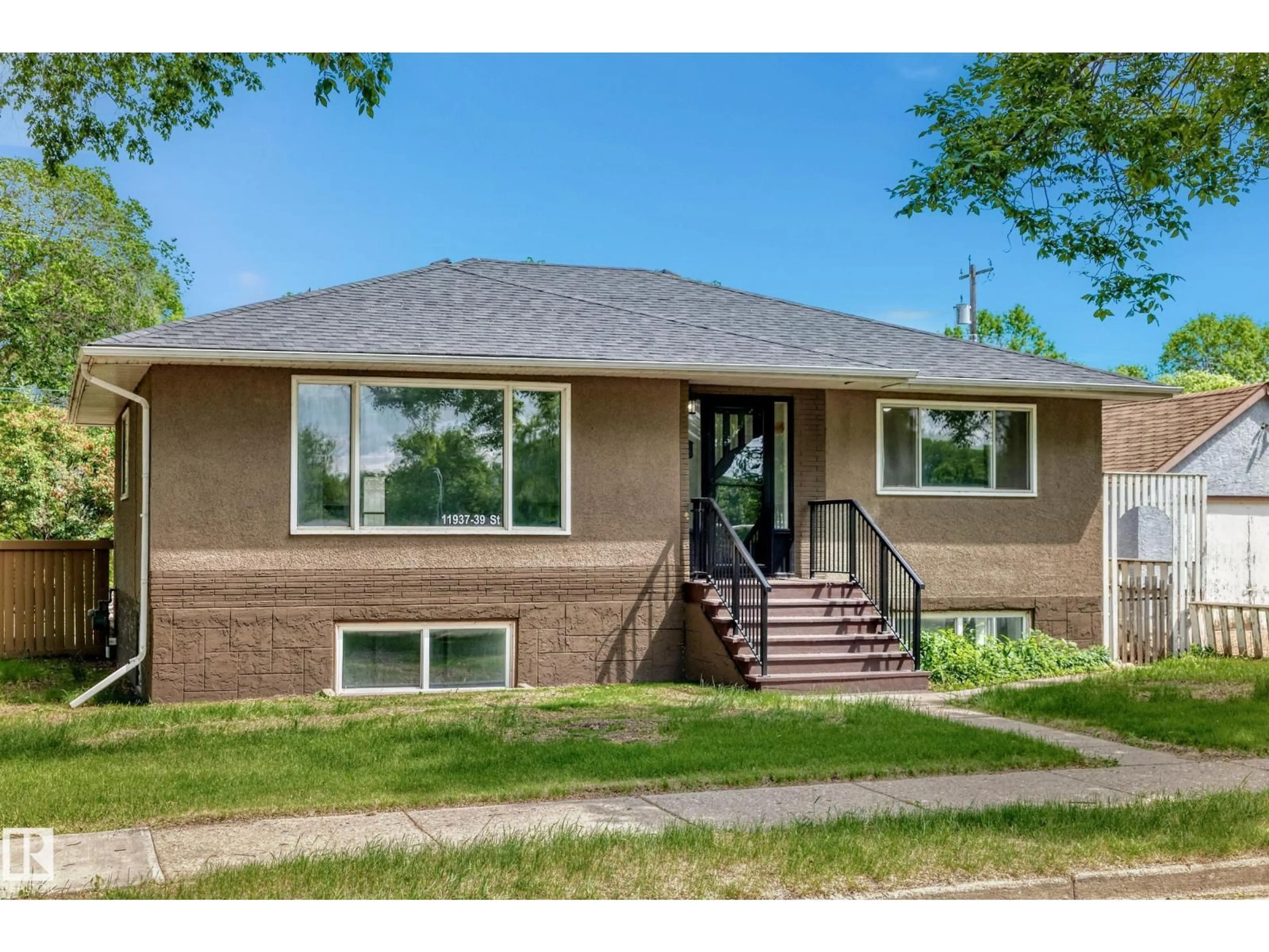 Home with brick exterior material, street for NW - 11937 39 ST, Edmonton Alberta T5W2J6