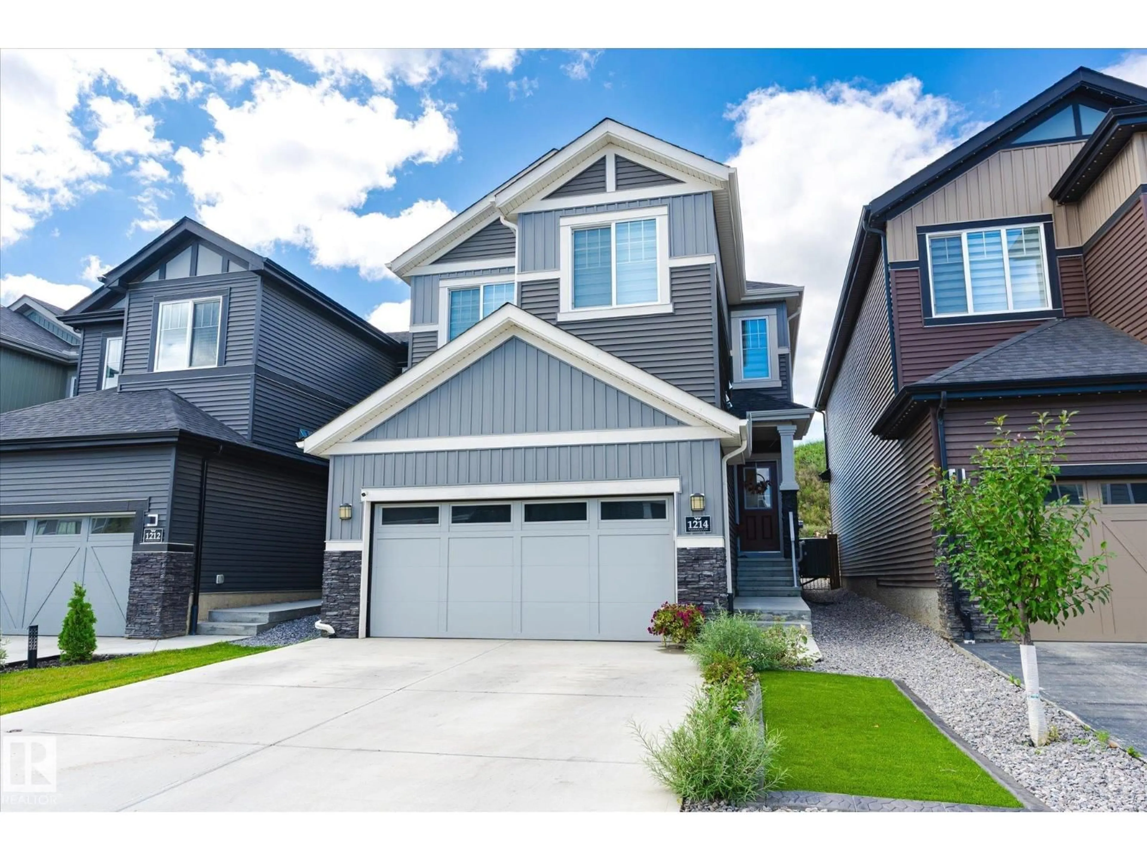 Home with vinyl exterior material, street for 1214 EATON LN, Edmonton Alberta T6M1M9
