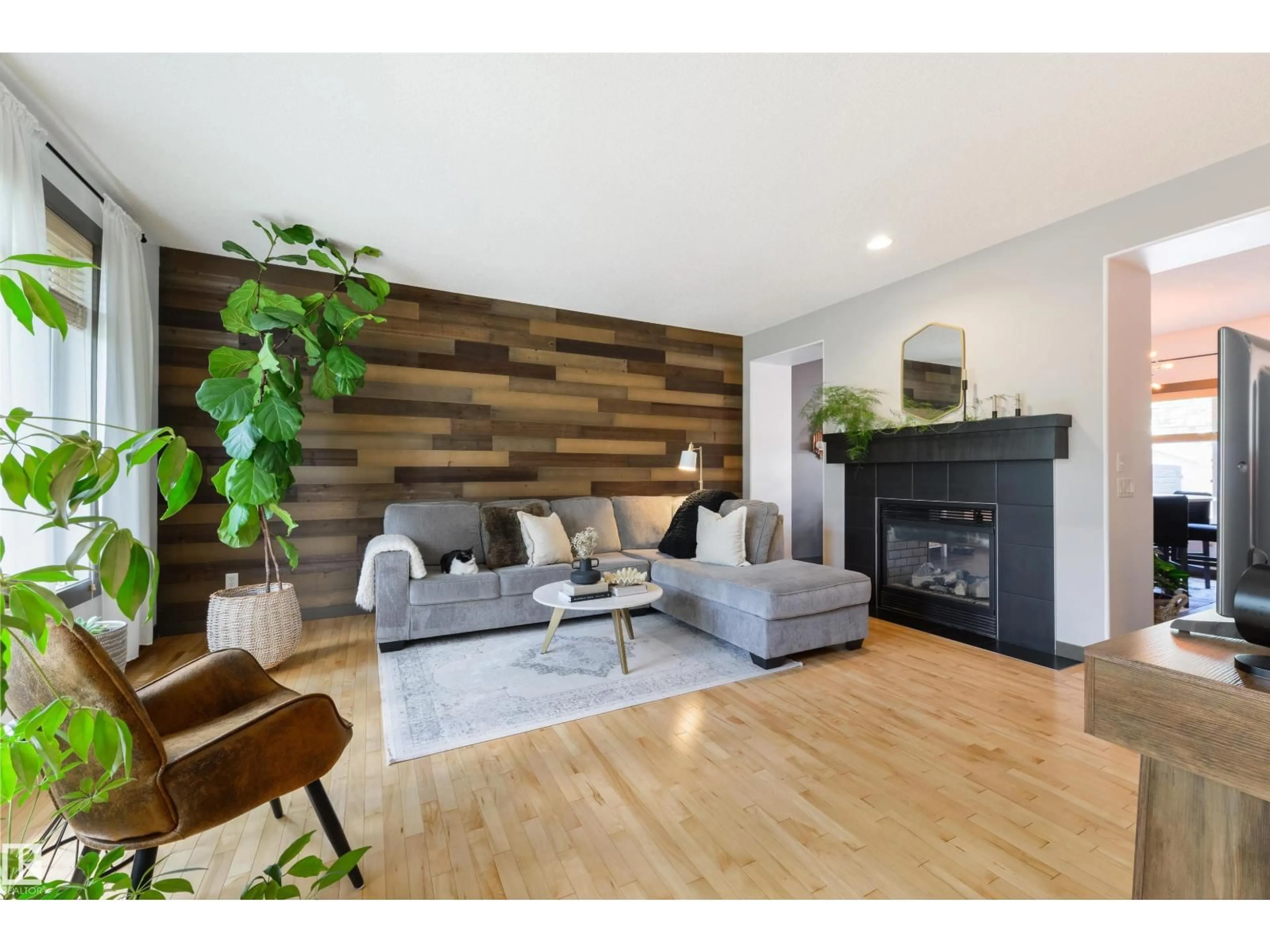 Living room with furniture, wood/laminate floor for 362 GRIESBACH SCHOOL RD, Edmonton Alberta T5E1Z8
