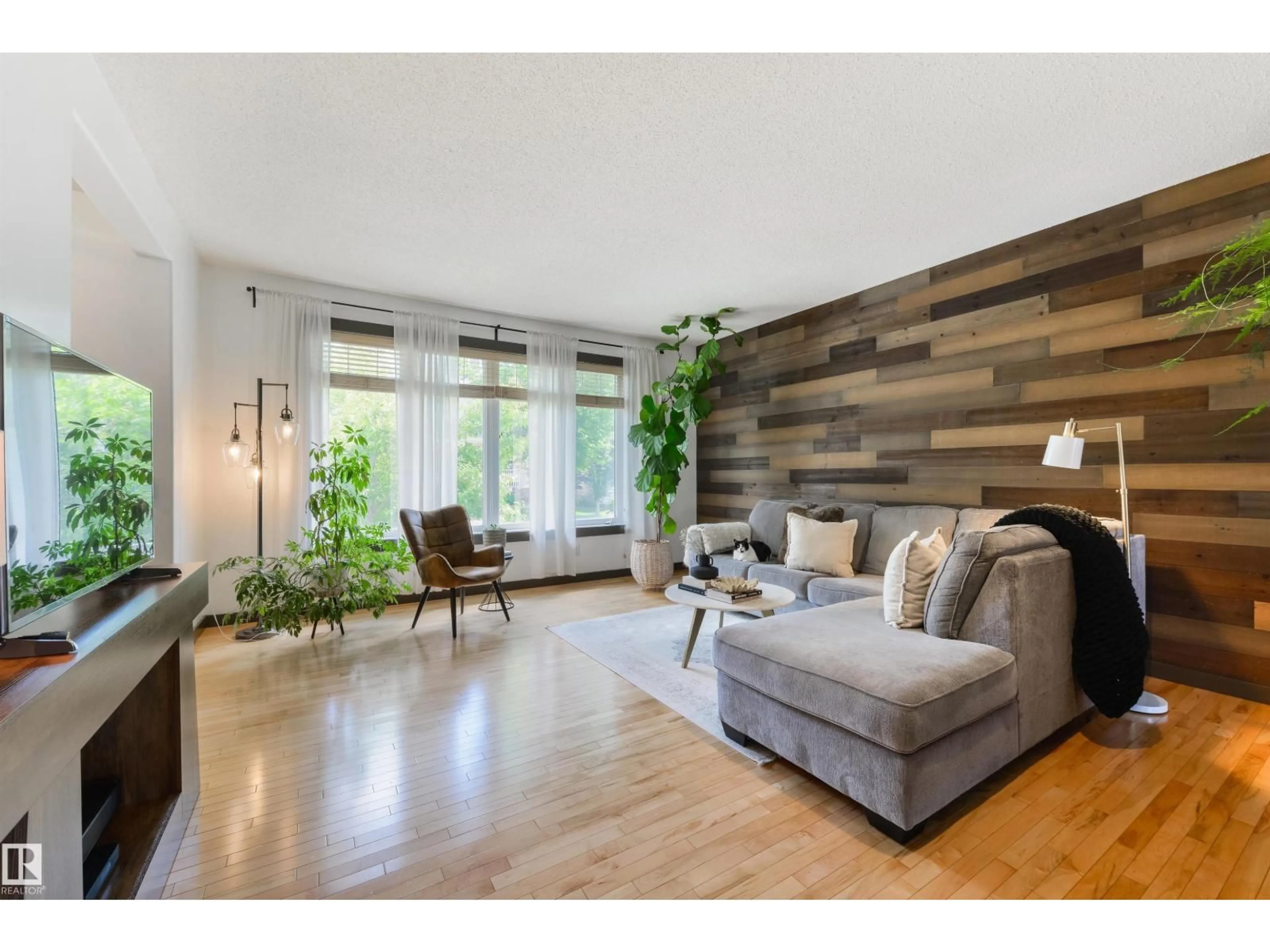 Living room with furniture, wood/laminate floor for 362 GRIESBACH SCHOOL RD, Edmonton Alberta T5E1Z8