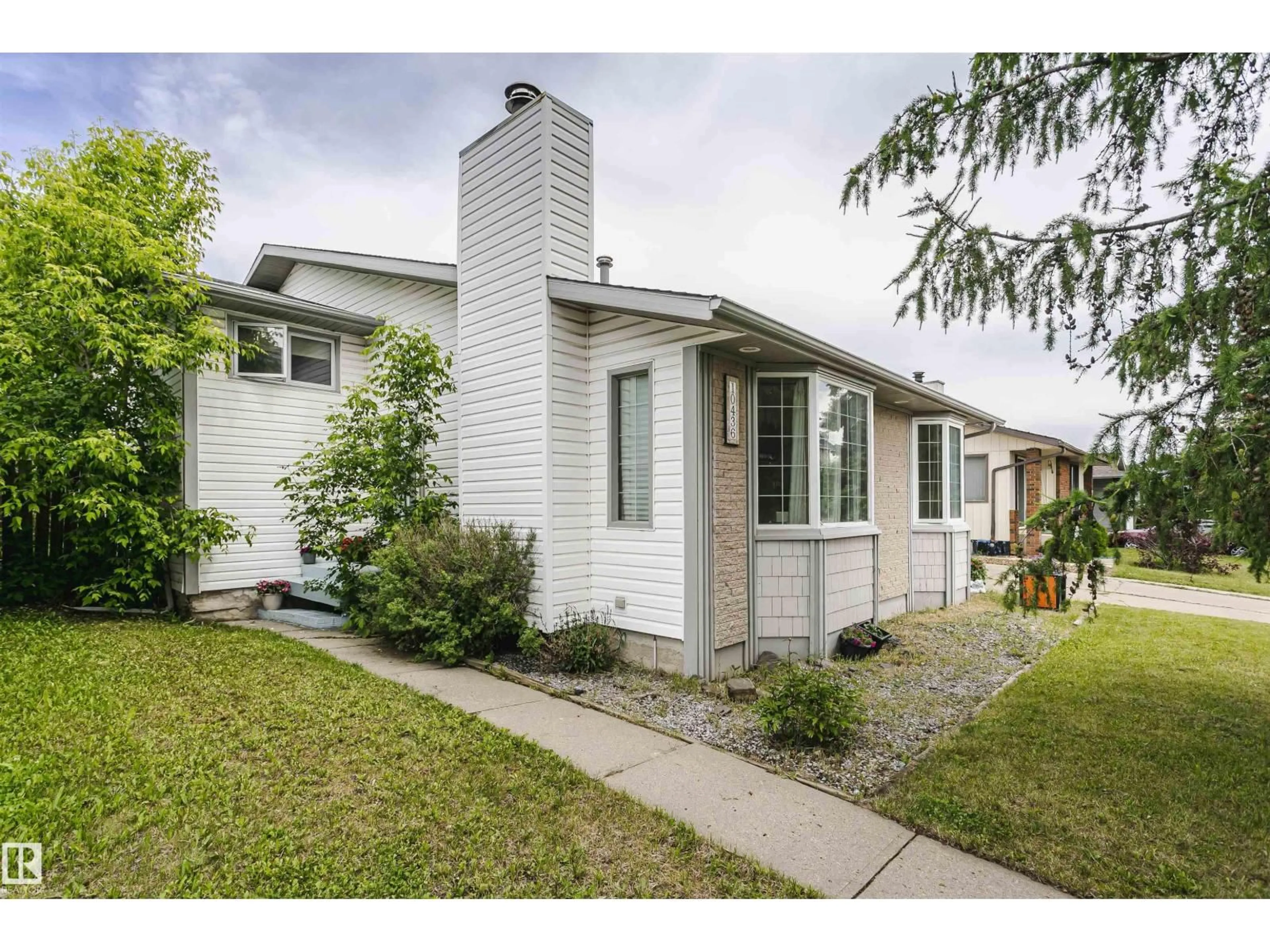 Home with vinyl exterior material, street for 10436 26 AV, Edmonton Alberta T6J4J9