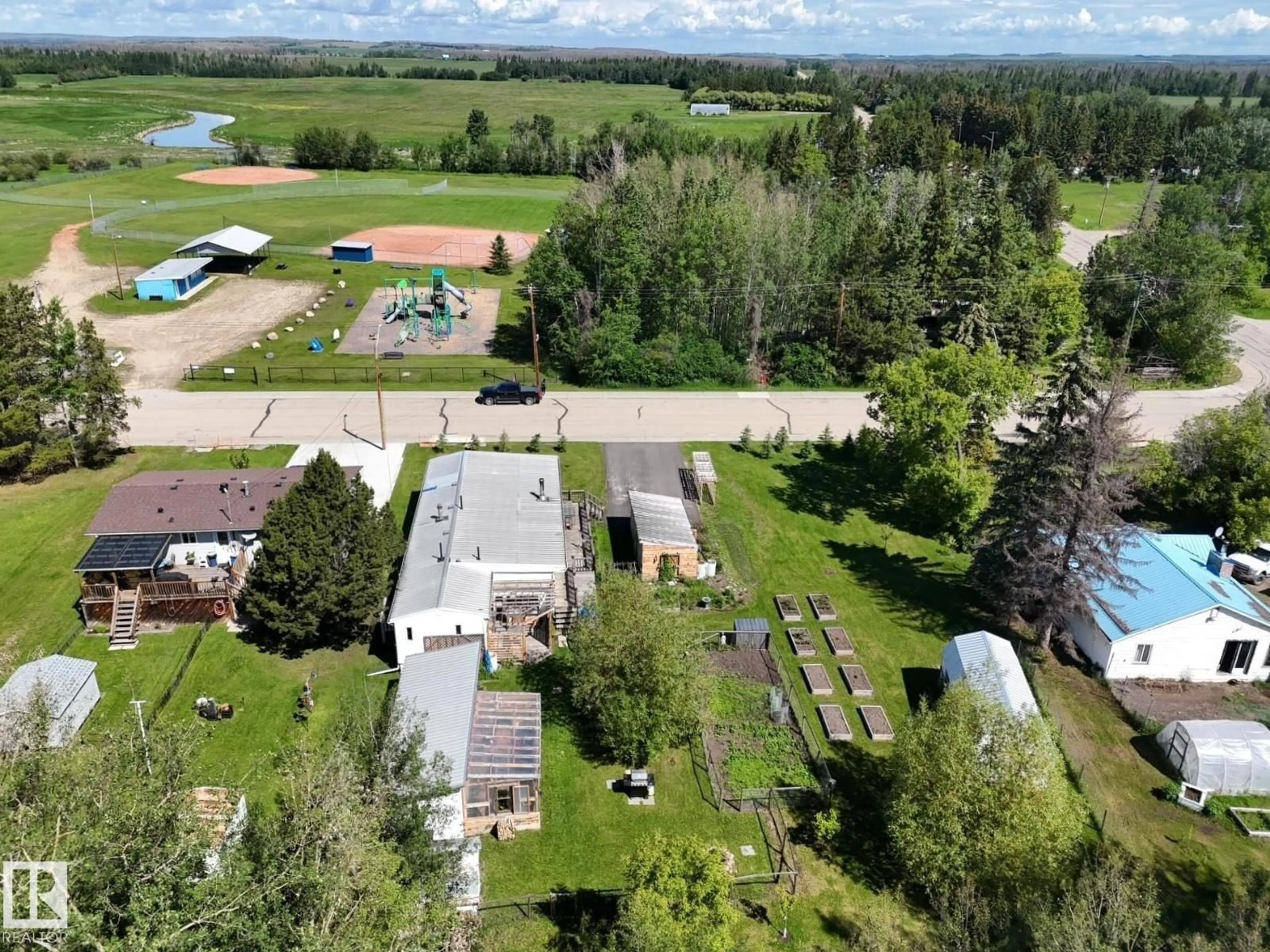 A pic from outside/outdoor area/front of a property/back of a property/a pic from drone, mountain view for 4707 54 AV, Wildwood Alberta T0E2M0