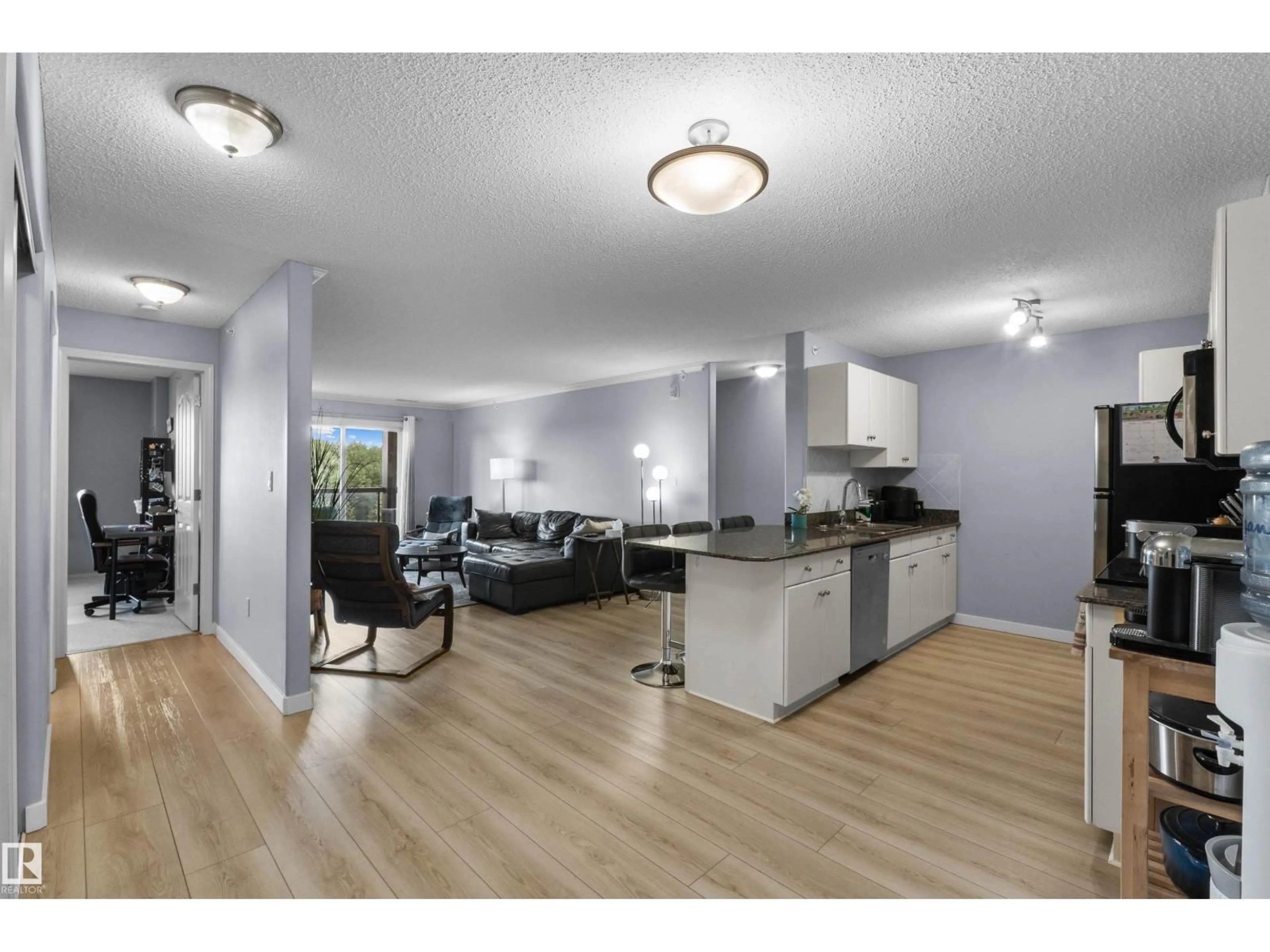 Open concept kitchen, wood/laminate floor for #414 - 279 SUDER GREENS DR, Edmonton Alberta T5T6X6