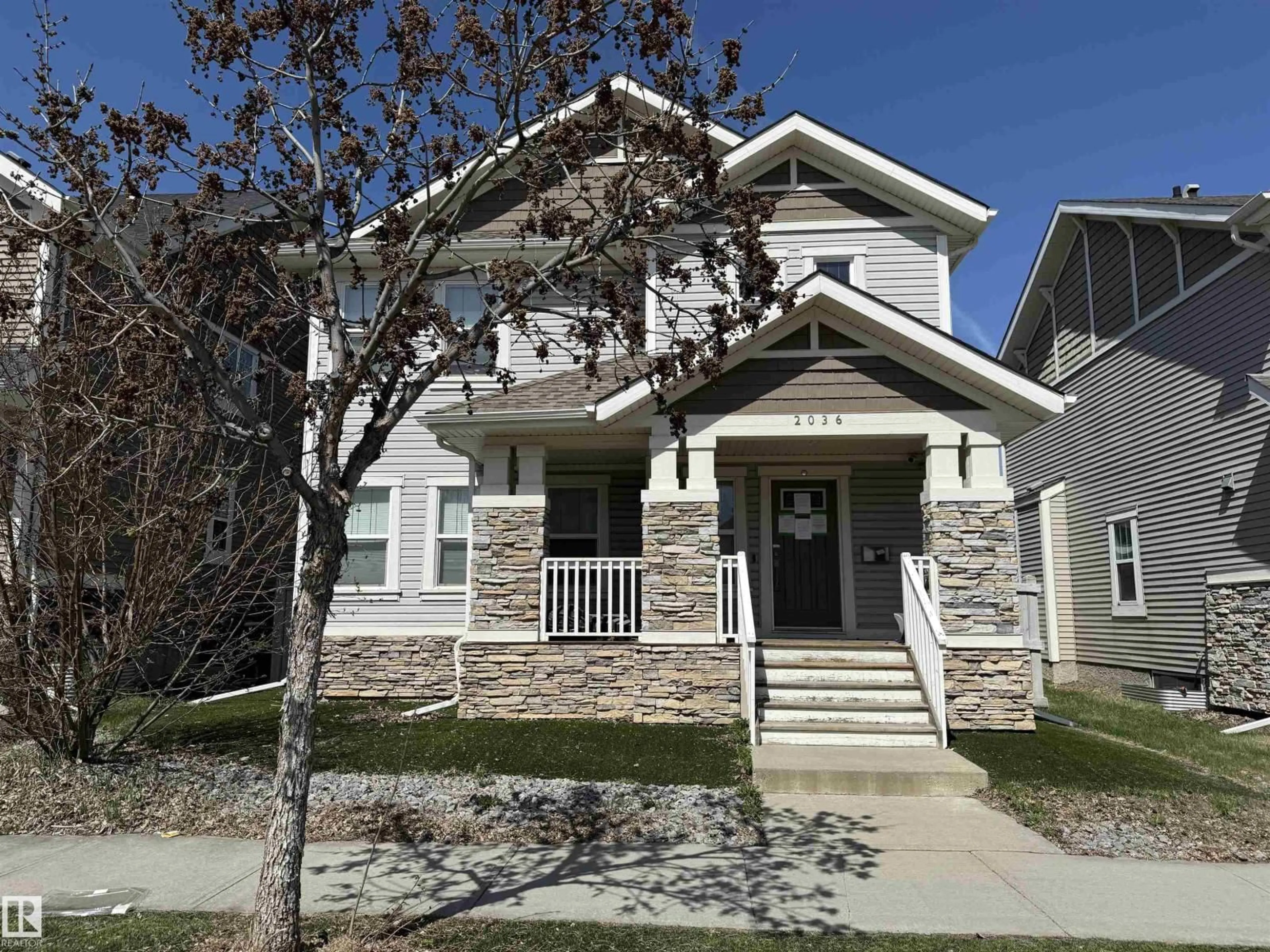 Home with vinyl exterior material, street for 2036 ROCHESTER AV, Edmonton Alberta T5E6H3