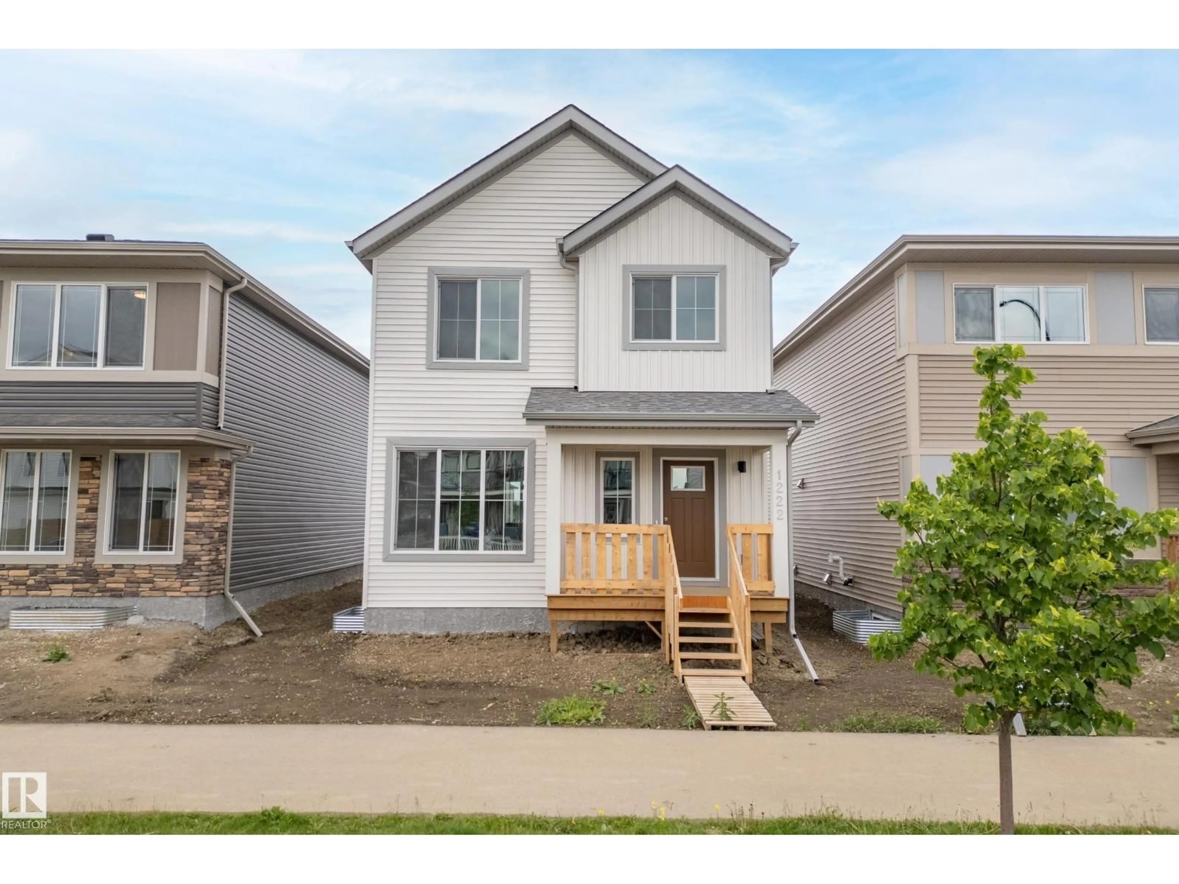 Home with vinyl exterior material, street for 1222 MCLEOD AV, Spruce Grove Alberta T7X4B7