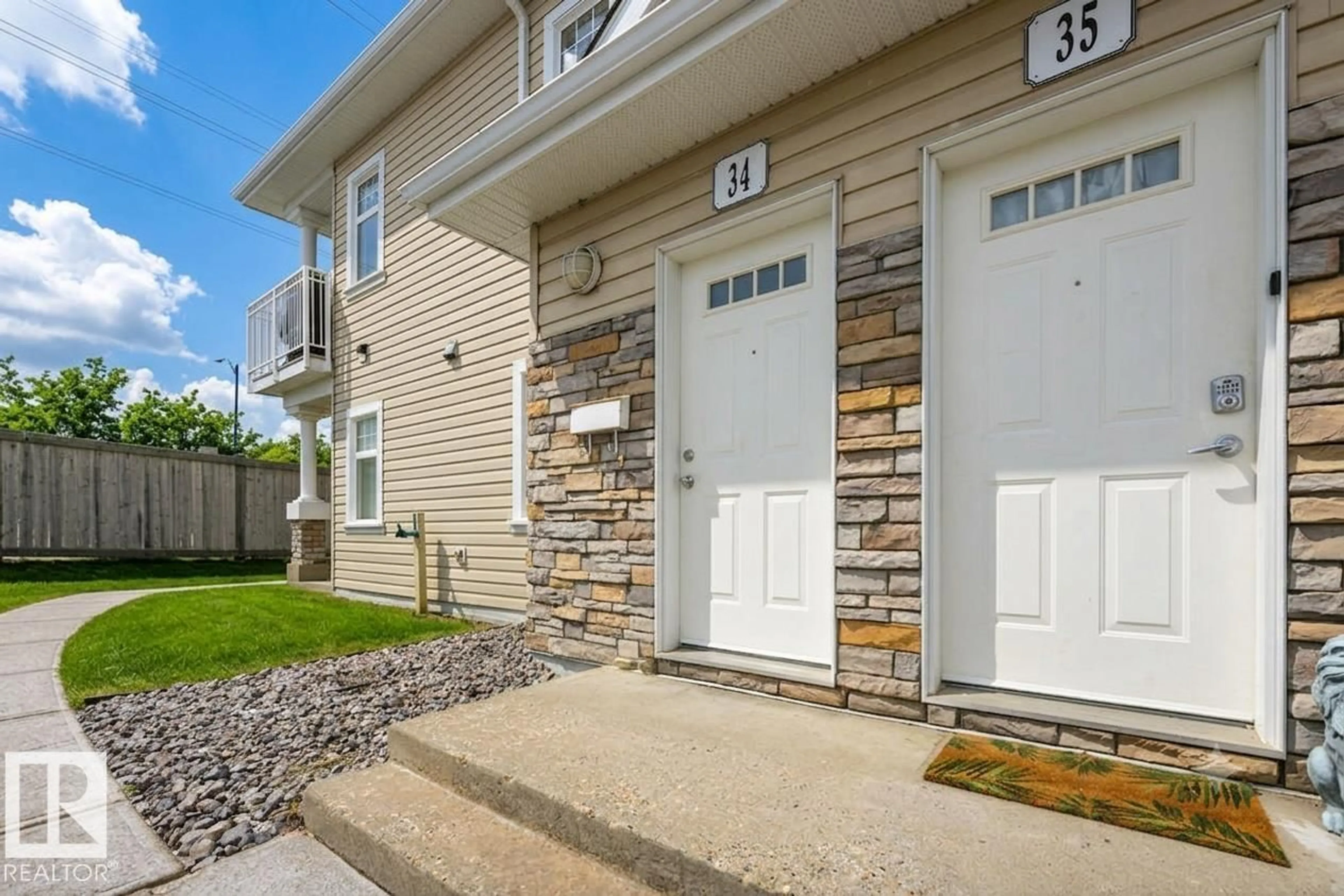 Home with vinyl exterior material, street for #34 - 1179 SUMMERSIDE DR, Edmonton Alberta T6X1K1