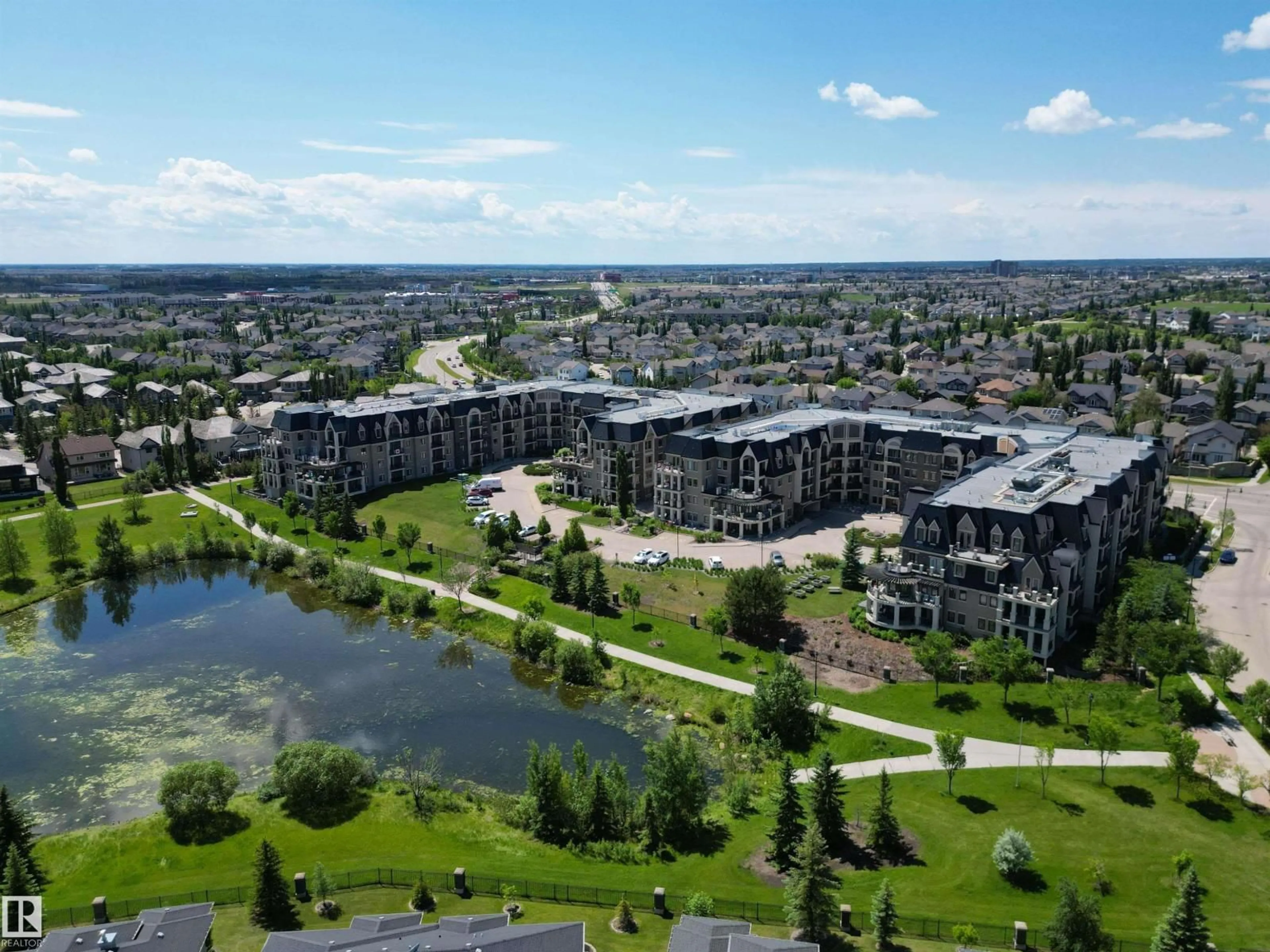 A pic from outside/outdoor area/front of a property/back of a property/a pic from drone, water/lake/river/ocean view for #312 - 6083 MAYNARD WY, Edmonton Alberta T6R0S5