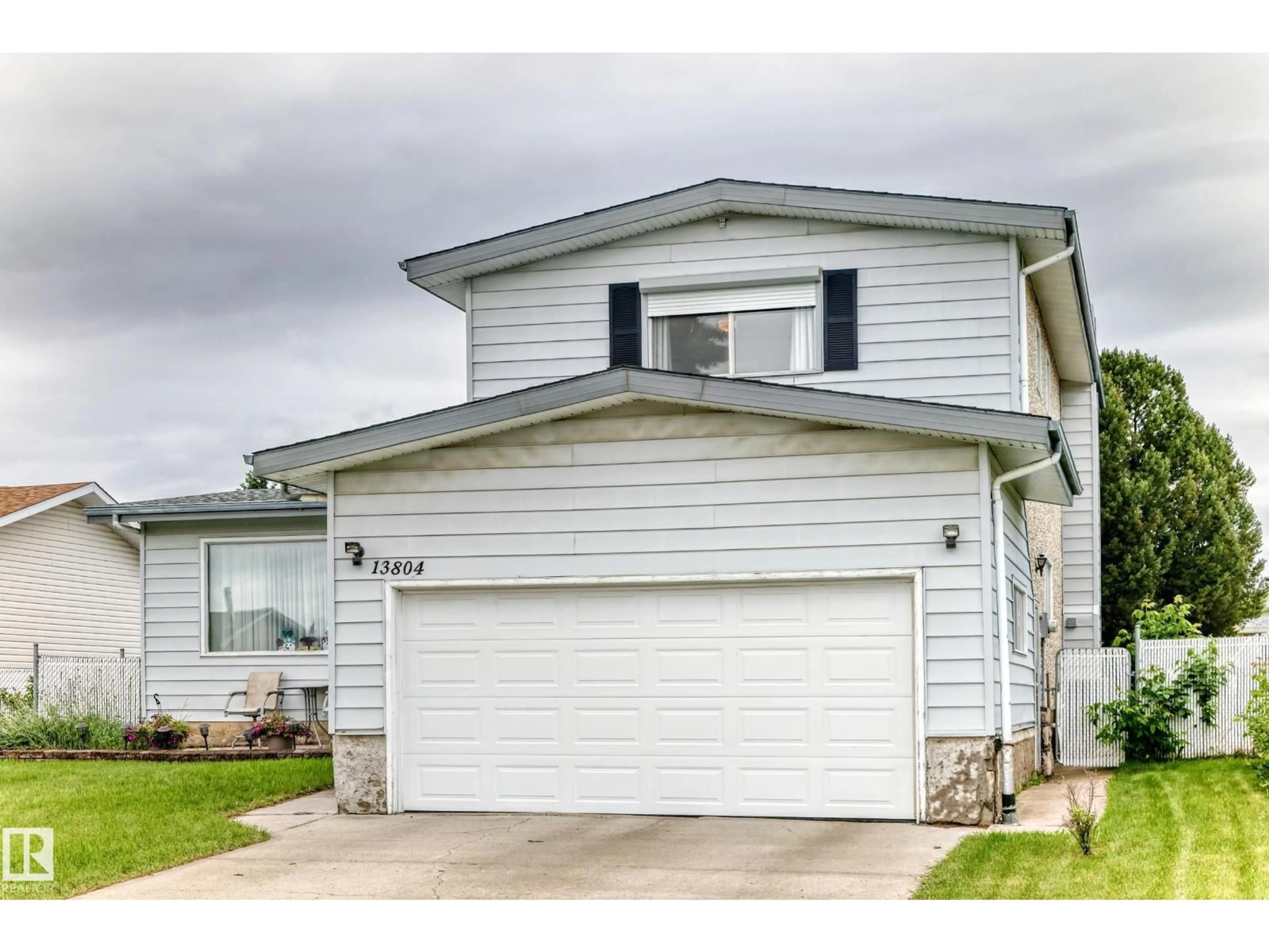 Home with vinyl exterior material, street for NW - 13804 87 ST, Edmonton Alberta T5E3E9