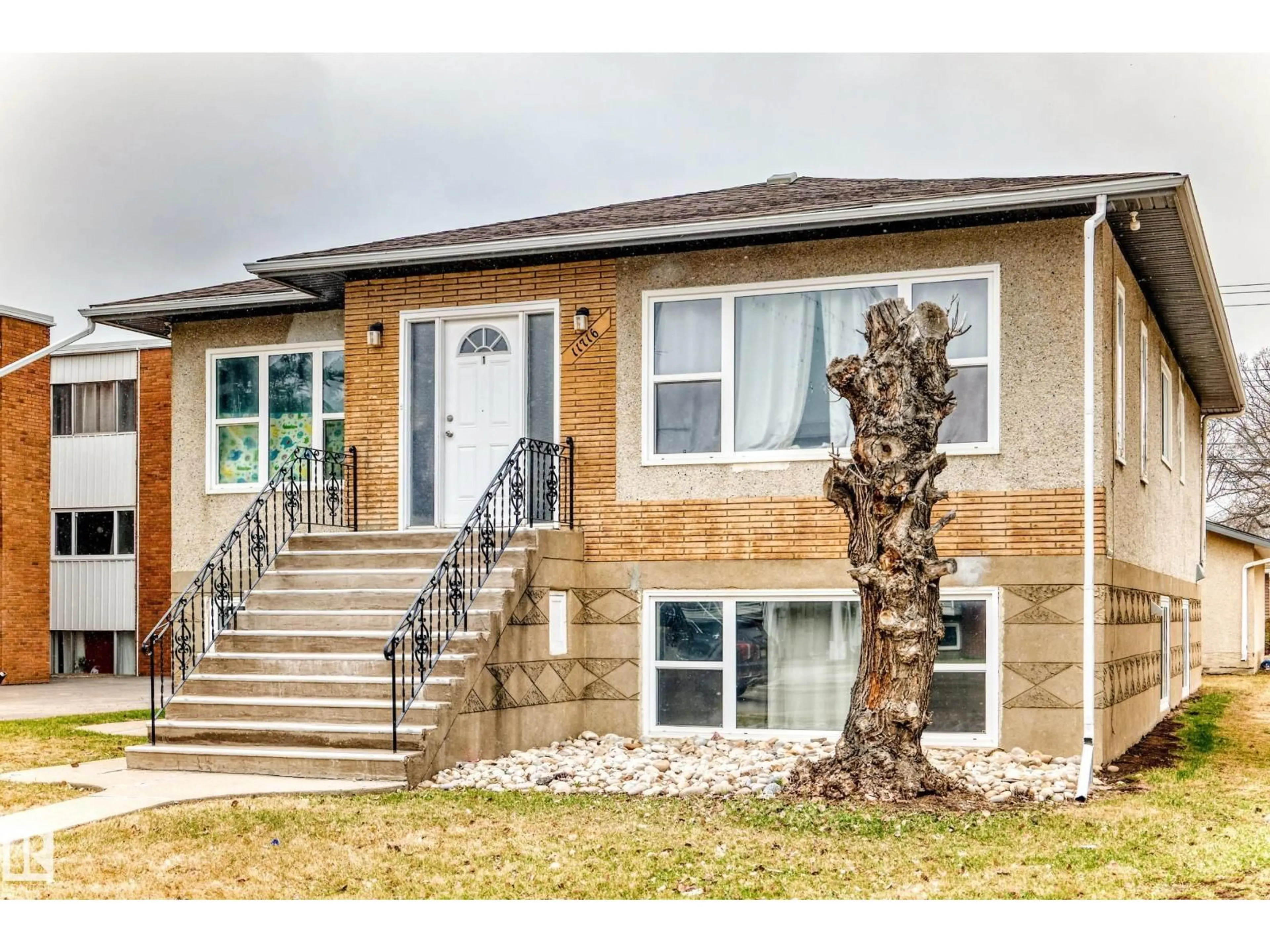 Home with brick exterior material, street for 11716 124 ST, Edmonton Alberta T5M0K9