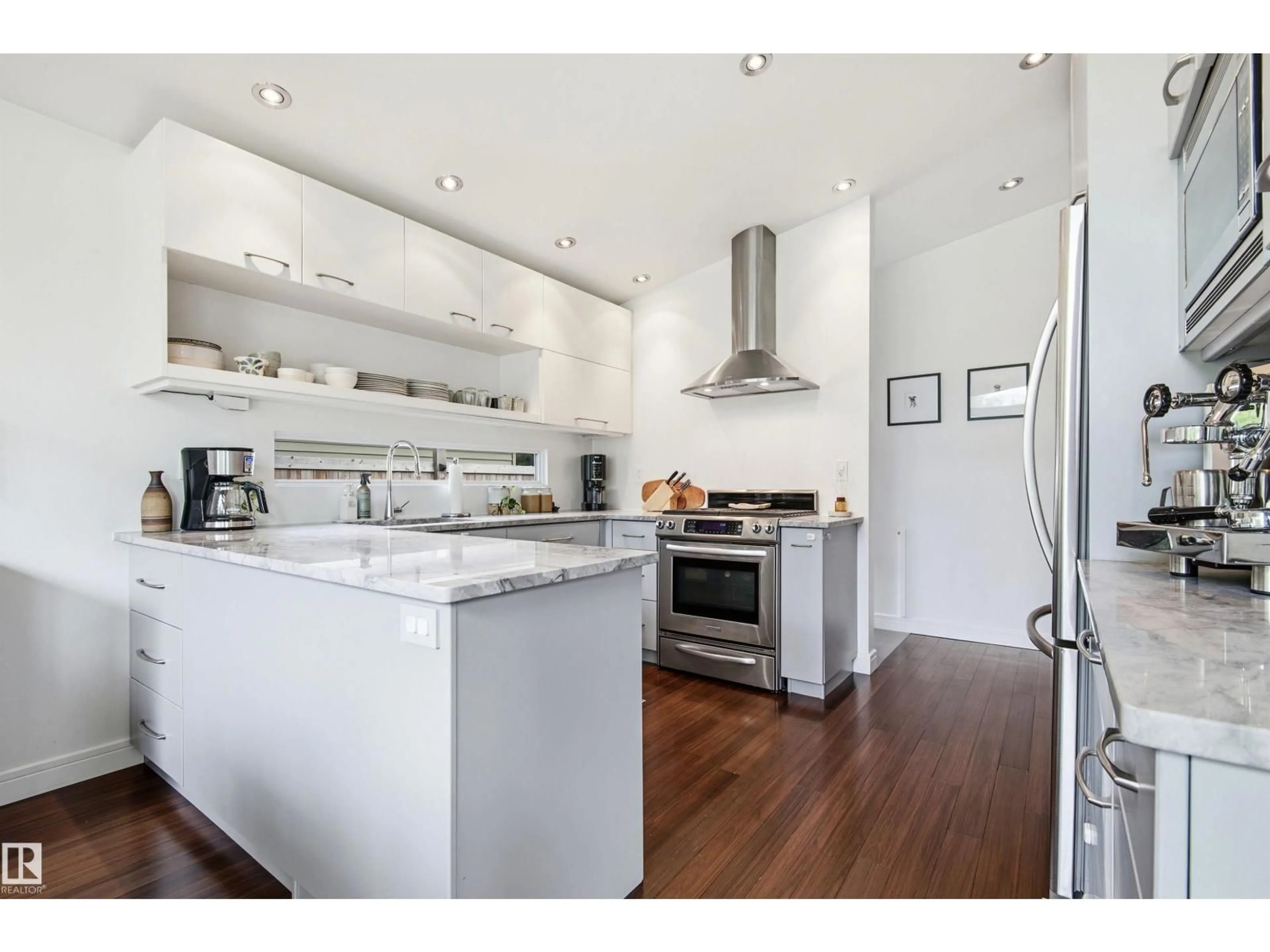Open concept kitchen, wood/laminate floor for 6905 102A AV, Edmonton Alberta T6A0S1