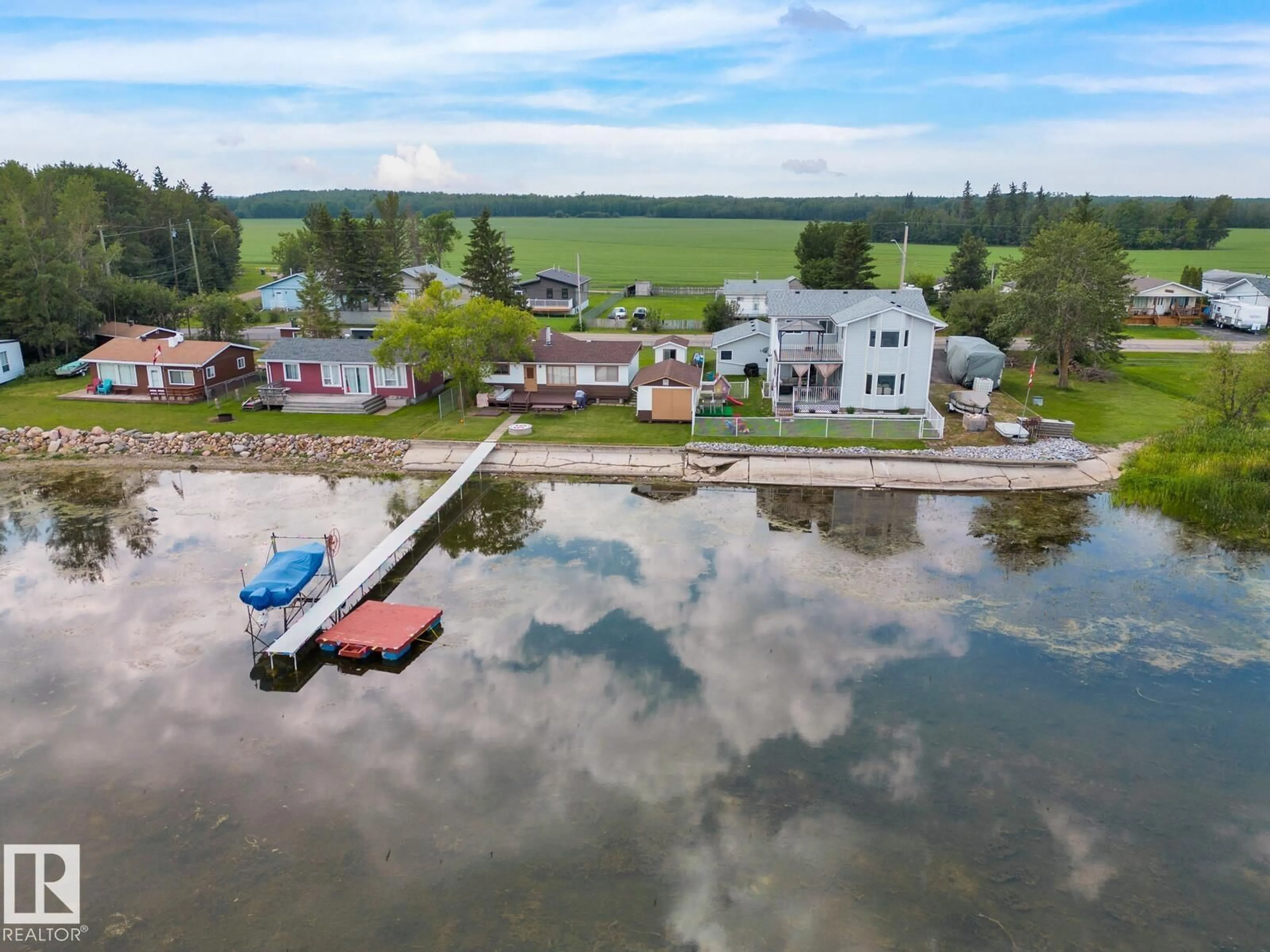 A pic from outside/outdoor area/front of a property/back of a property/a pic from drone, water/lake/river/ocean view for 6510 50 AV, Rural Lac Ste. Anne County Alberta T0E0A0