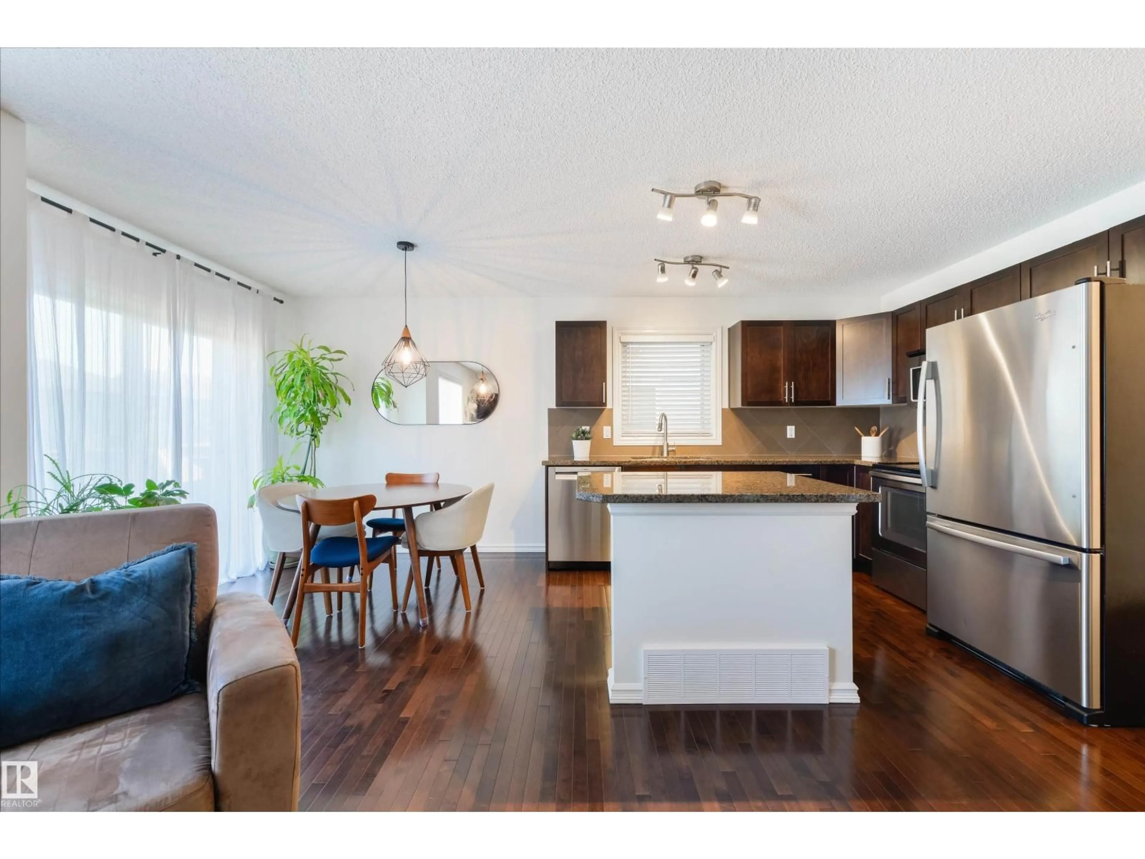 Open concept kitchen, wood/laminate floor for 2340 CASSELMAN CR, Edmonton Alberta T6W0W1