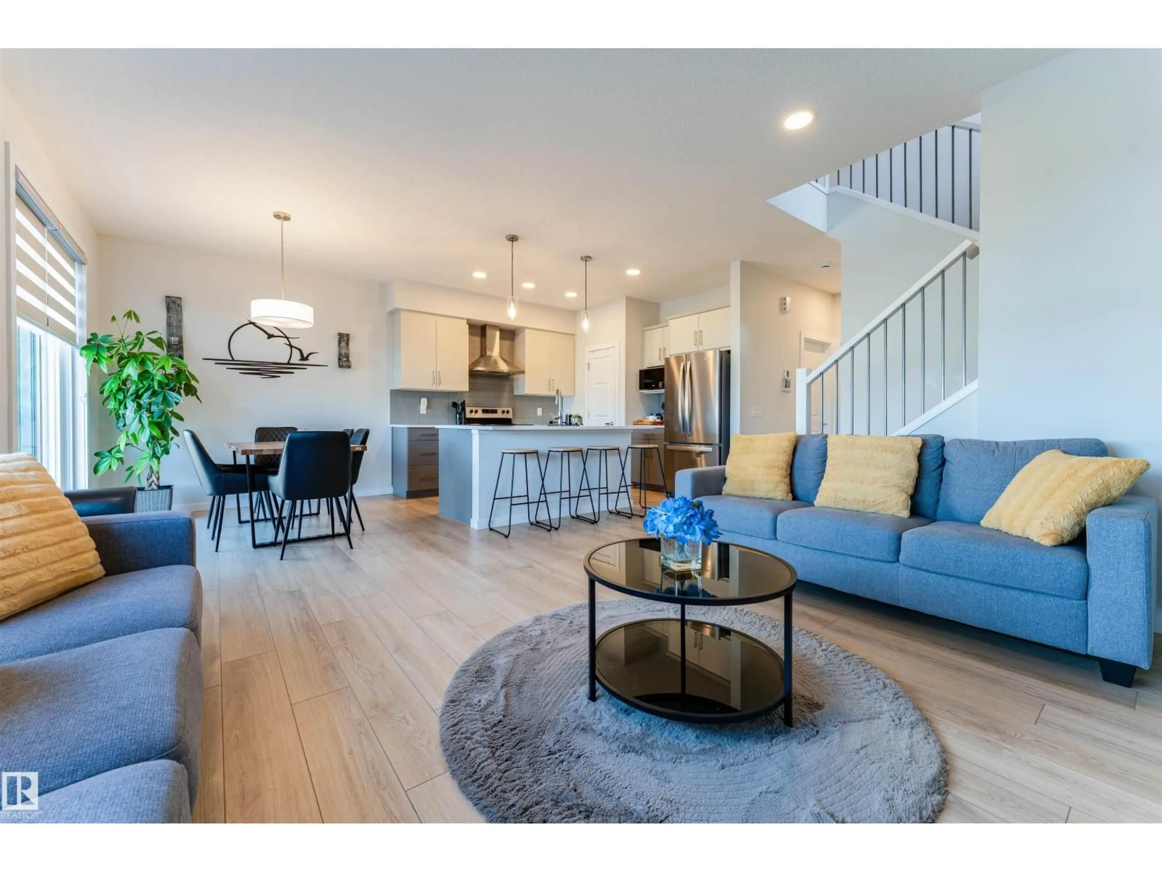 Open concept kitchen, wood/laminate floor for 8426 228A ST, Edmonton Alberta T5T4A3