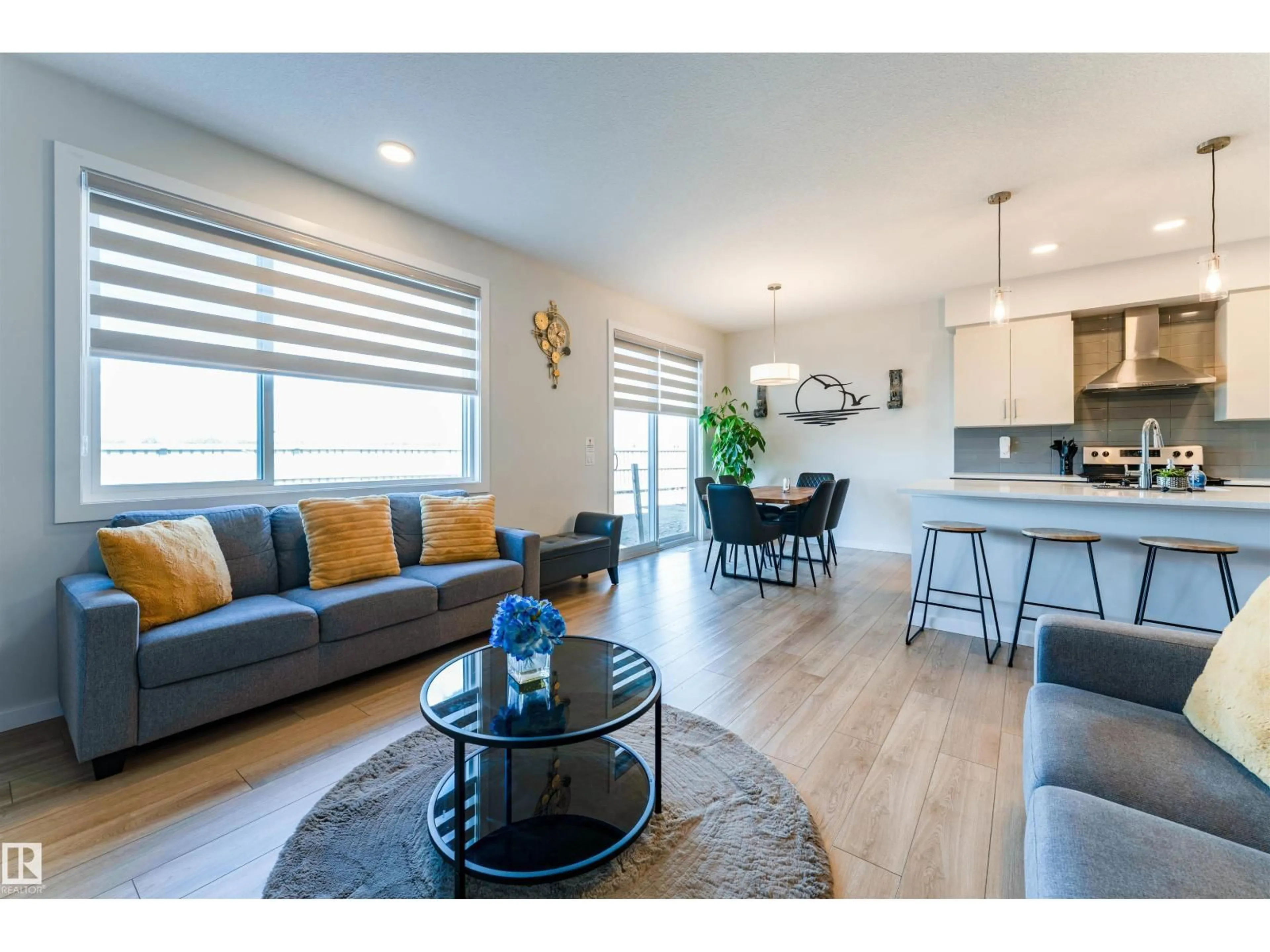 Living room with furniture, wood/laminate floor for 8426 228A ST, Edmonton Alberta T5T4A3