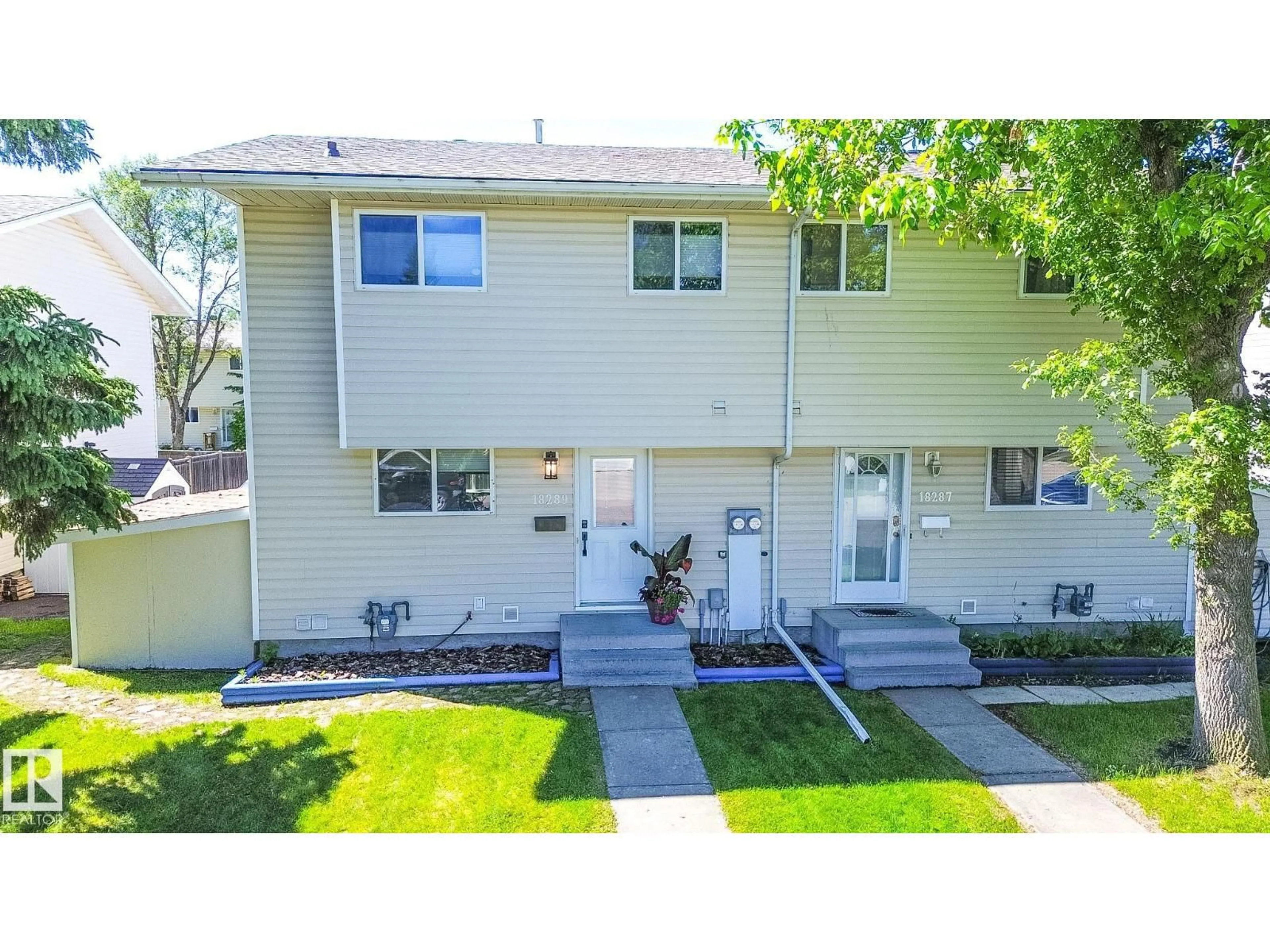 Home with vinyl exterior material, street for 18289 74 AV, Edmonton Alberta T5T2G6