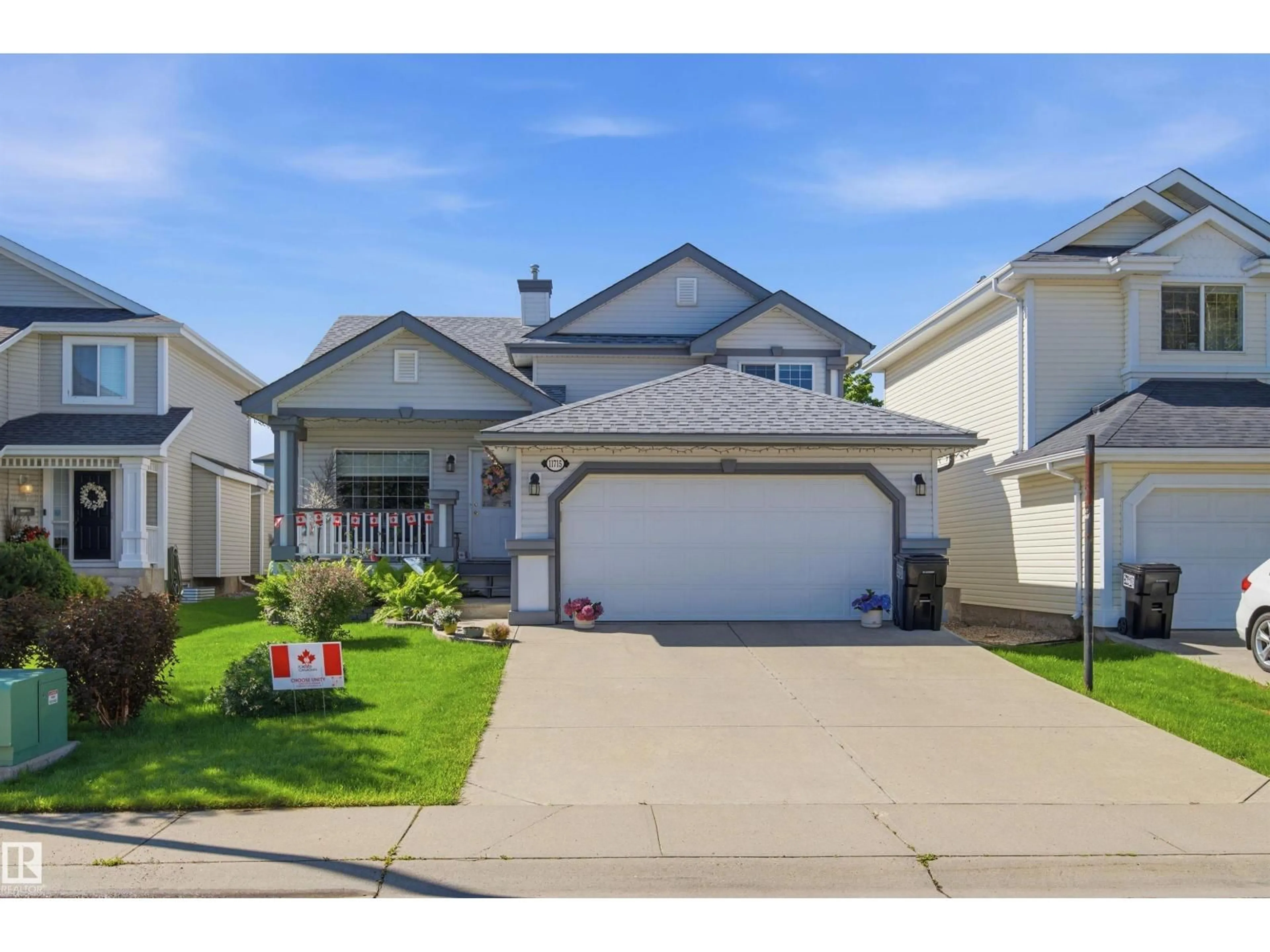 Home with vinyl exterior material, street for NW - 11715 11B AV, Edmonton Alberta T6J7E5