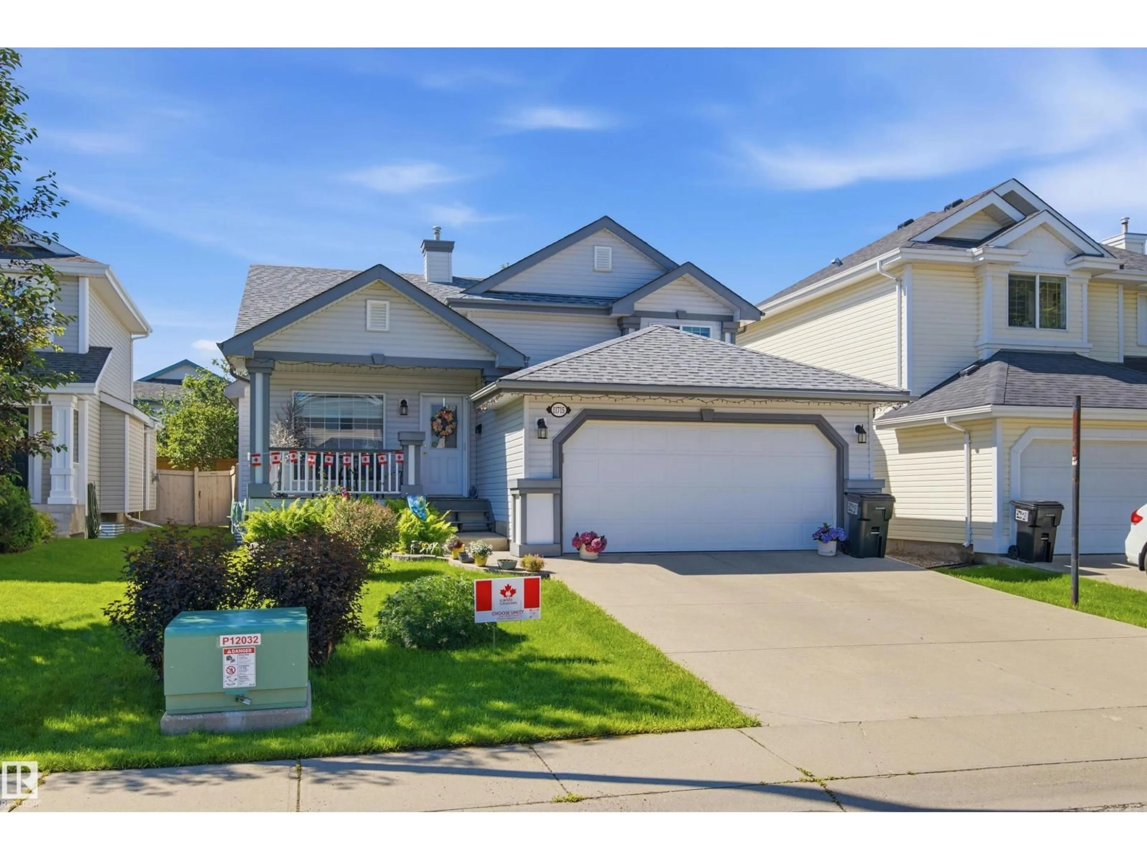 Home with vinyl exterior material, street for NW - 11715 11B AV, Edmonton Alberta T6J7E5