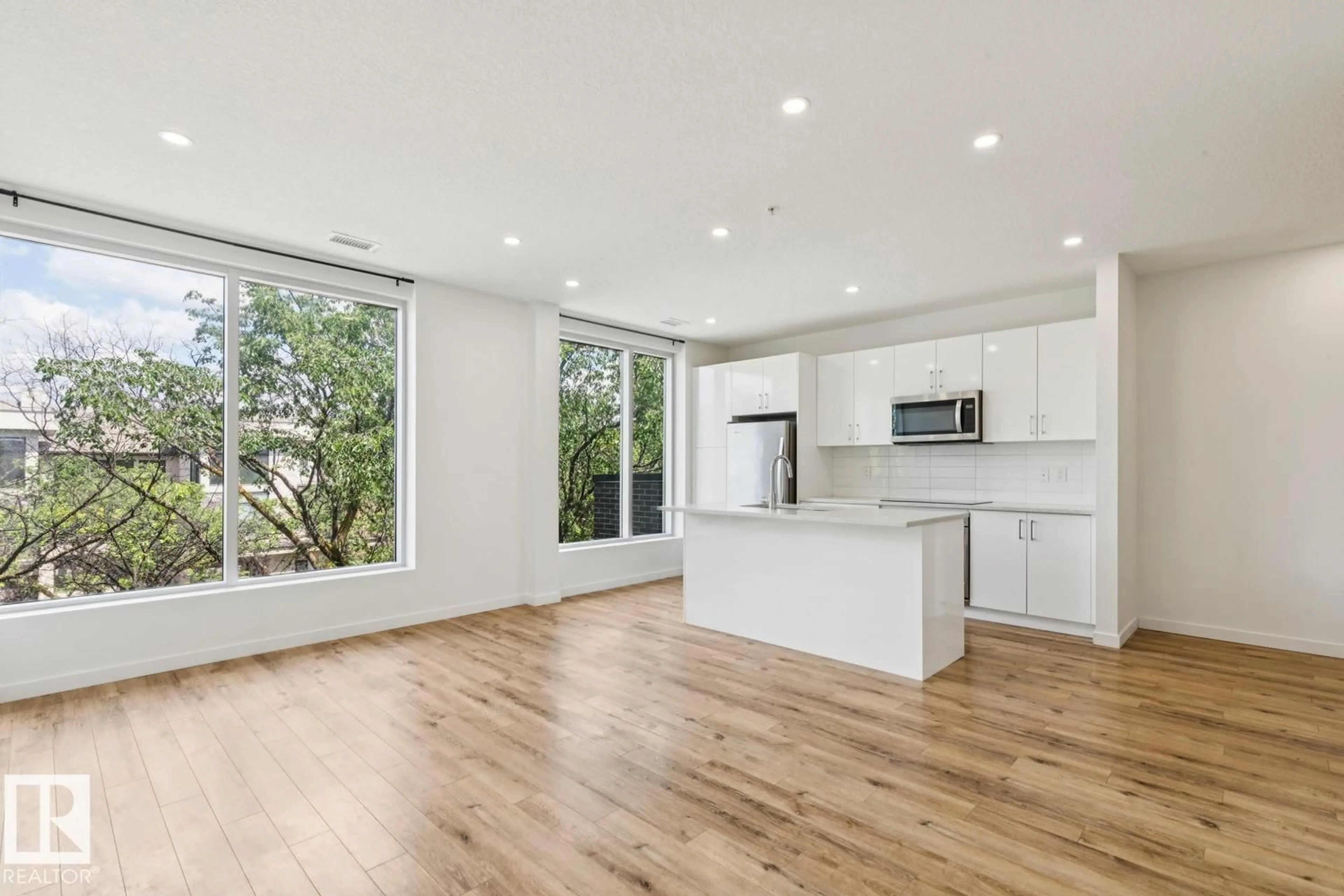 Open concept kitchen, wood/laminate floor for 415 11503 76 AV NW, Edmonton Alberta T6G0K6