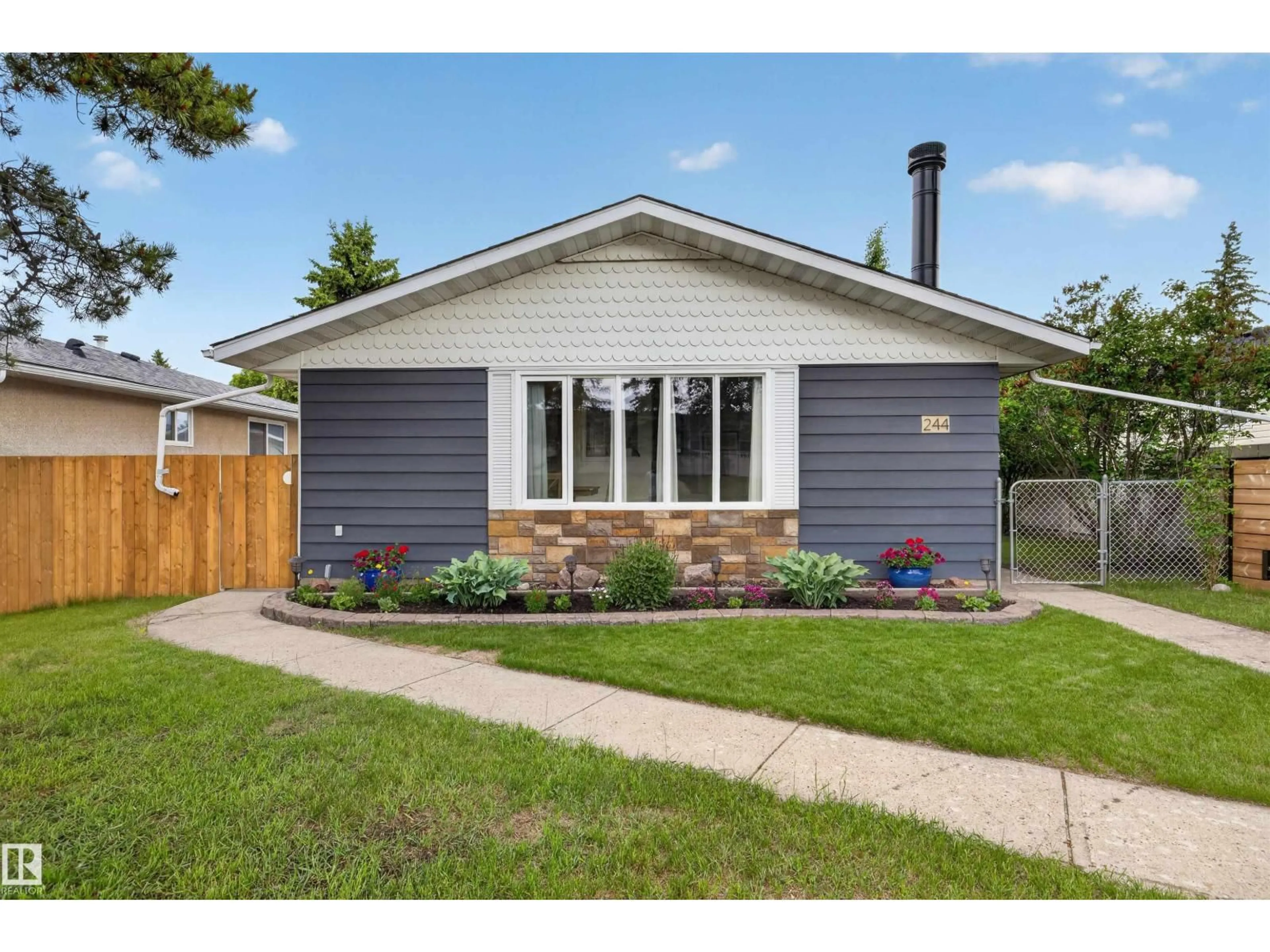 Home with vinyl exterior material, street for 244 KNOTTWOOD RD, Edmonton Alberta T6K1Y4
