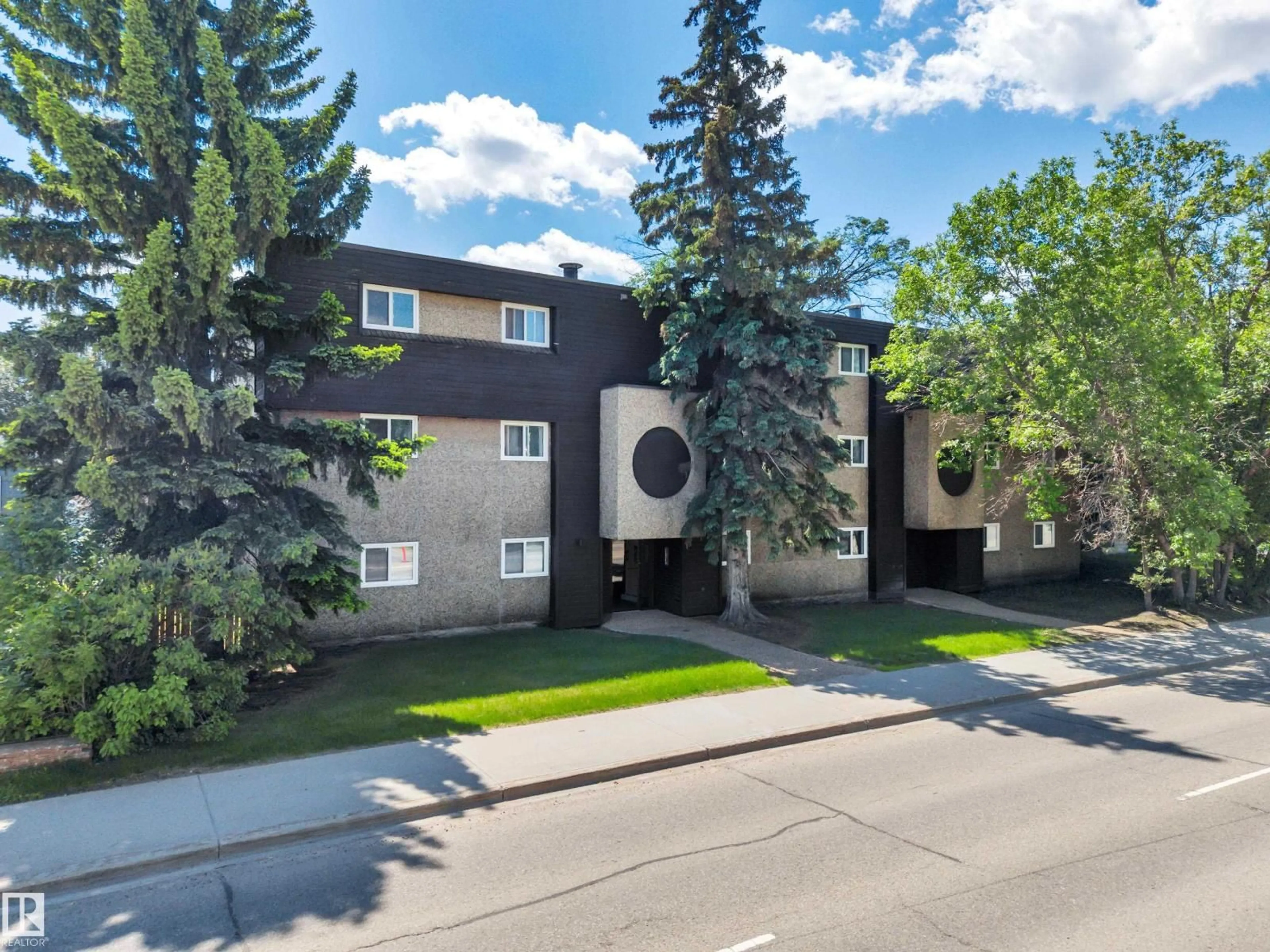 A pic from outside/outdoor area/front of a property/back of a property/a pic from drone, street for 201 - 7915 112 AV NW, Edmonton Alberta T5B0E7