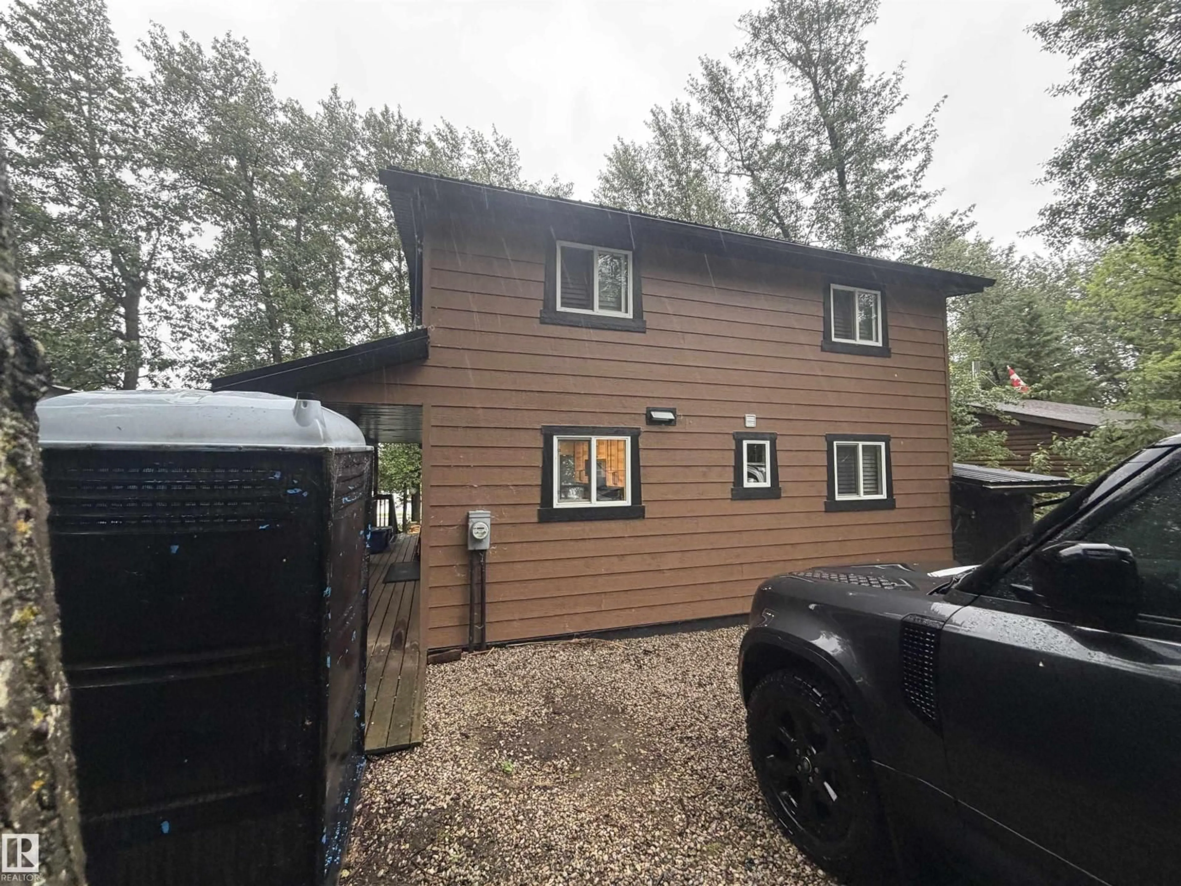 A pic from outside/outdoor area/front of a property/back of a property/a pic from drone, building for 770 - 52220 HGHWAY, Rural Parkland County Alberta T0E0H0