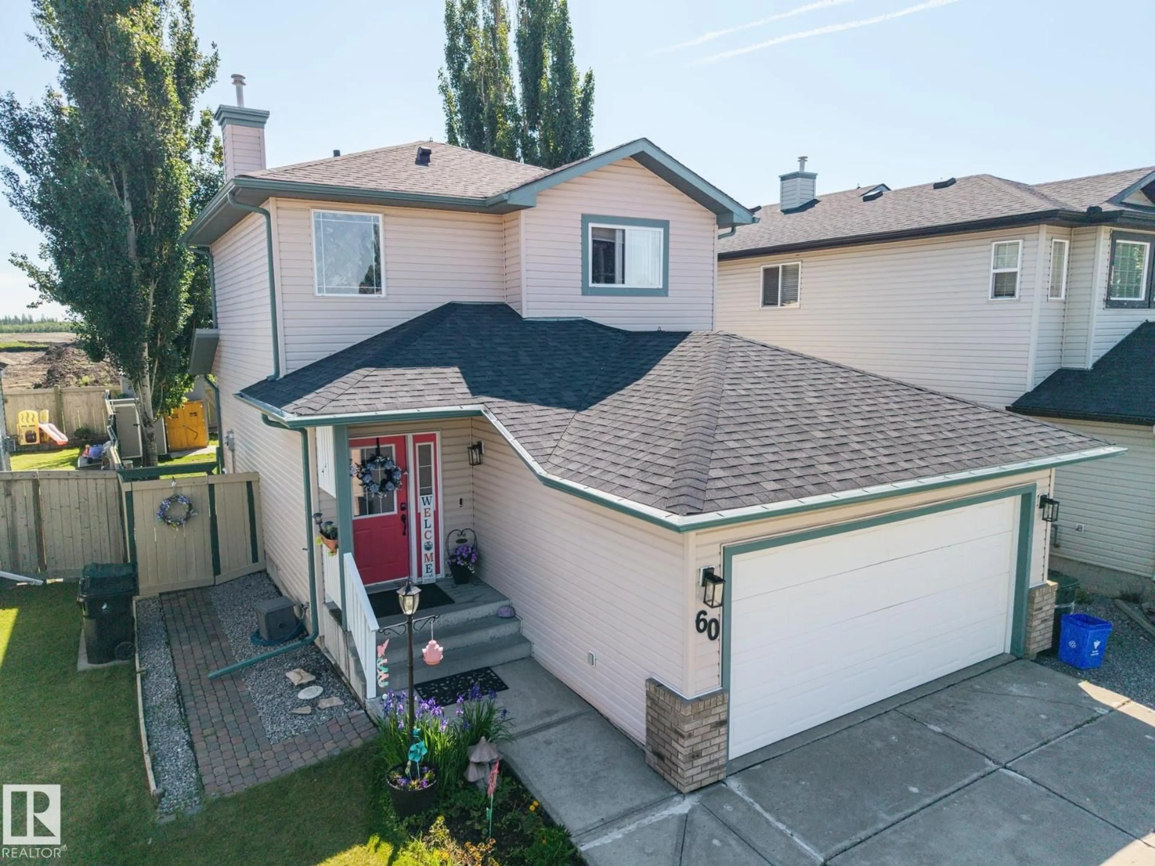 A pic from outside/outdoor area/front of a property/back of a property/a pic from drone, street for 60 LEYLAND WY, Spruce Grove Alberta T7X4P2